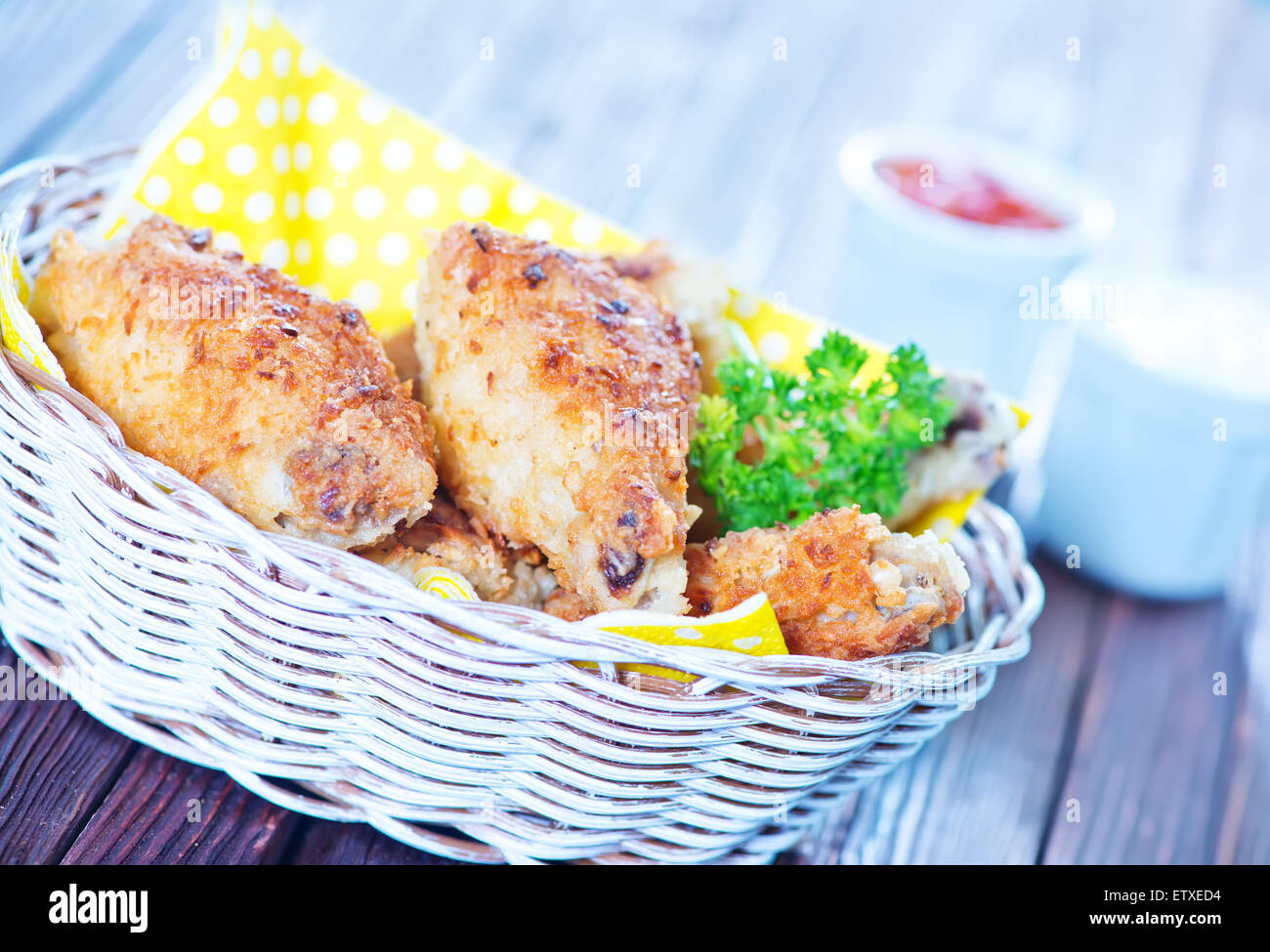 fried chicken wings in basket and on a table Stock Photo Alamy