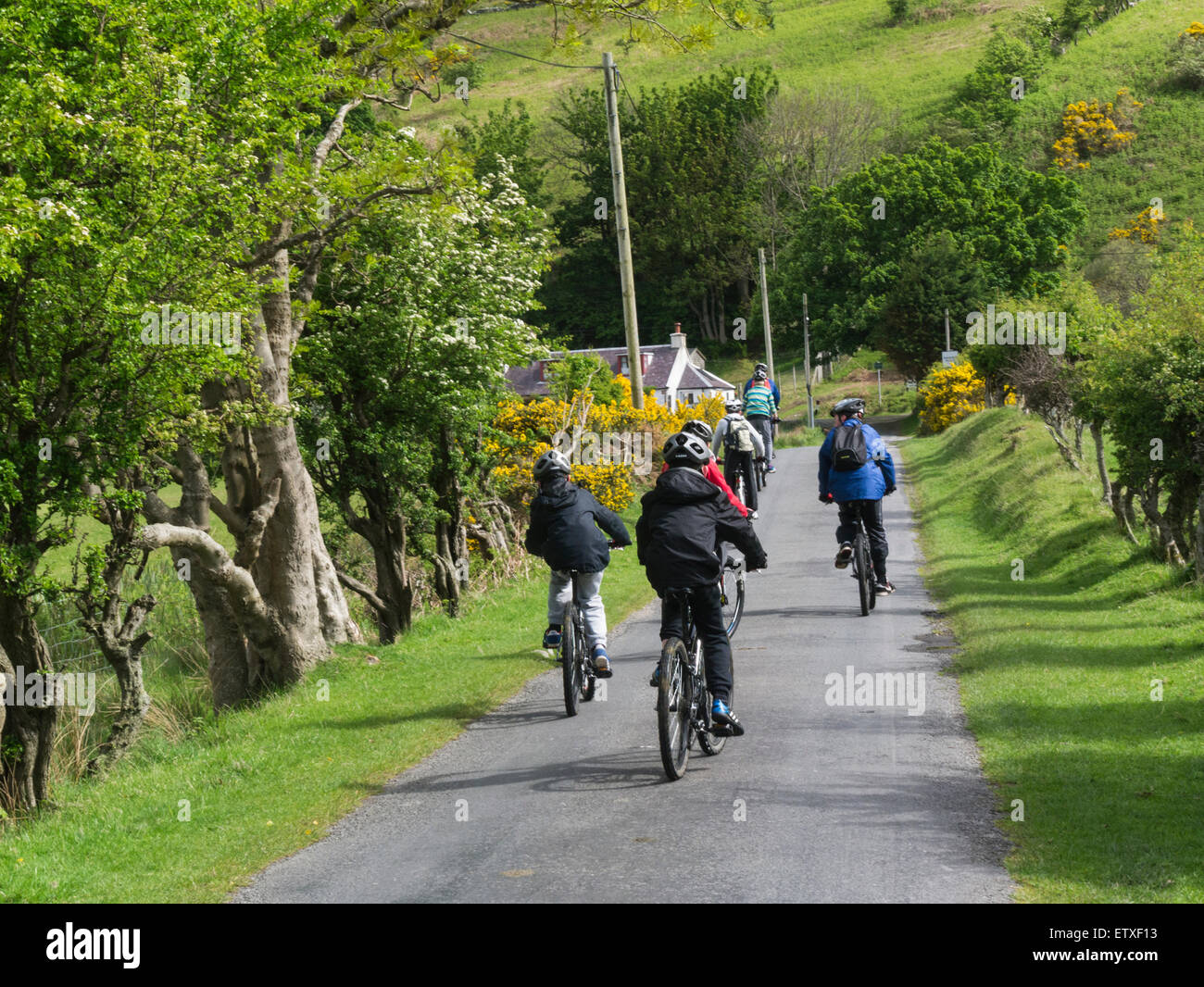 Group of school children on cycling activity holiday Lochranza Isle of Arran Scotland  one of the most beautiful and dramatic islands in Europe Stock Photo