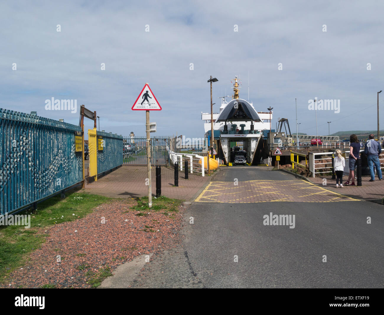 Cars and foot passengers disembarking from Isle of Arran ferry at Ardrossan ferry port Ayrshire Scotland important island transportation Stock Photo