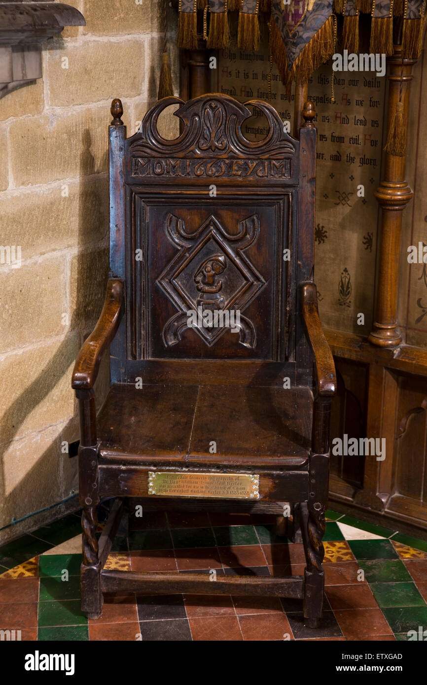 UK, England, Derbyshire, Eyam, Parish Church of St Lawrence, William Mompesson’s 1665 chair by altar Stock Photo