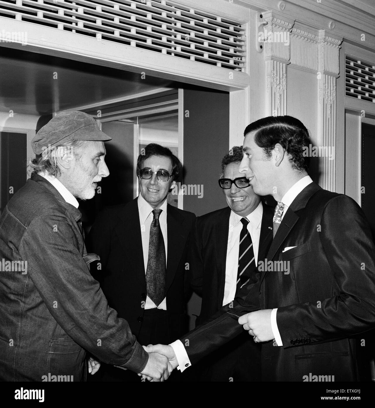 Prince Charles dines with The Goons at The Dorchester, London. Left to right, Spike Milligan, Peter Sellers and Michael Bentine greet the Prince. Harry Secombe was at home ill. 11th November 1974. Stock Photo
