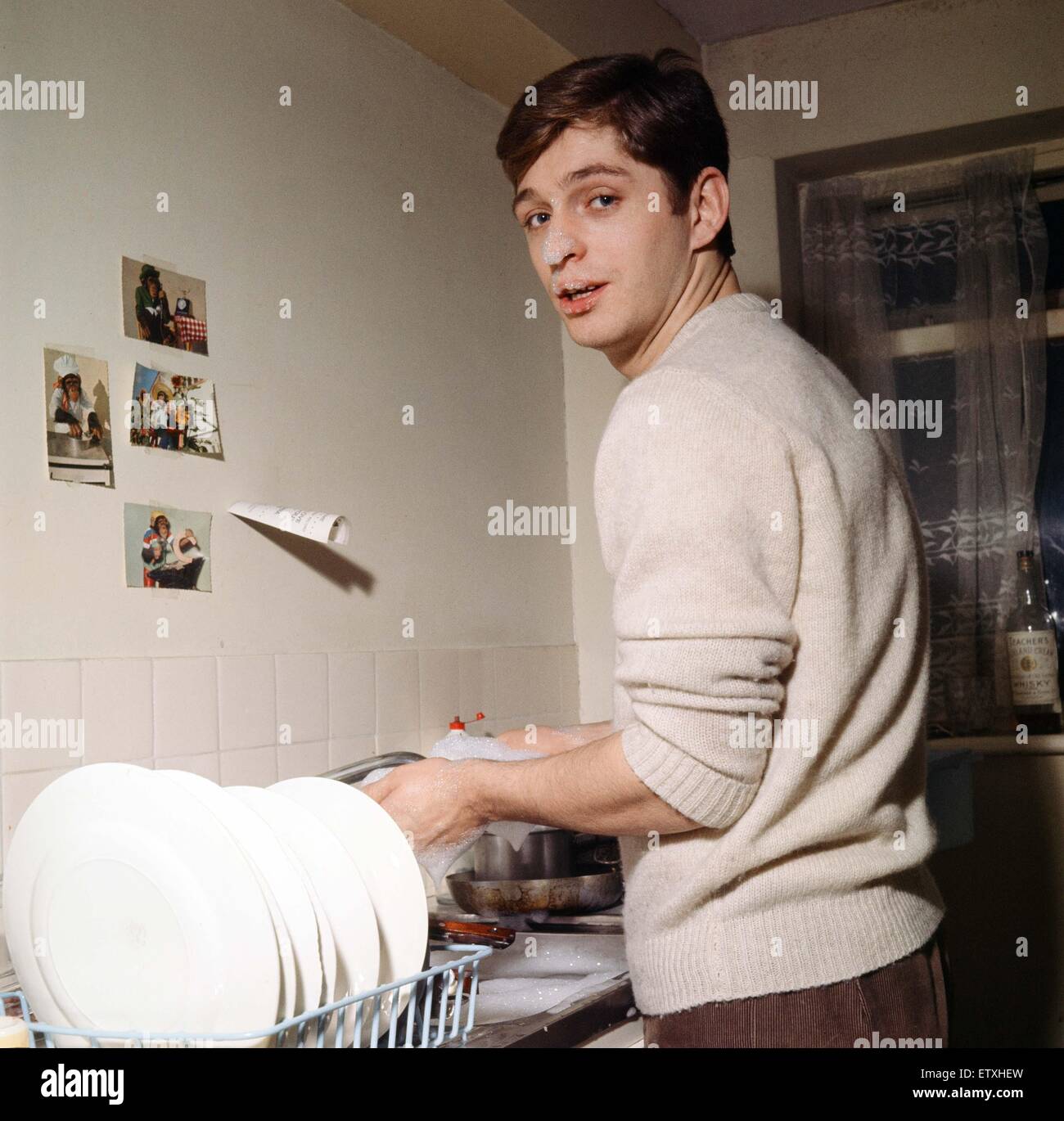 1960s 1950s SMILING MAN HUSBAND IN APRON WASHING AND DRYING DISHES IN  KITCHEN - s10163c DEB001 HARS OLD FASHION 1 TOWEL DISH ASSISTANT LIFESTYLE  STUDIO SHOT HOME LIFE COPY SPACE HALF-LENGTH DRY