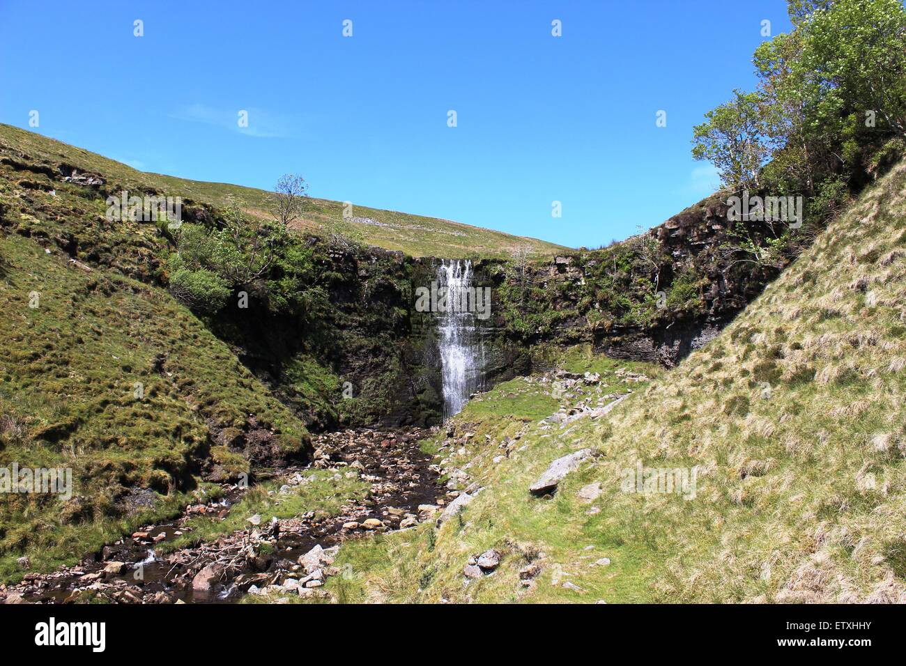 Waterfall on Force Fill, a stream running down the eastern slopes of Whernside in North Yorkshire, England Stock Photo