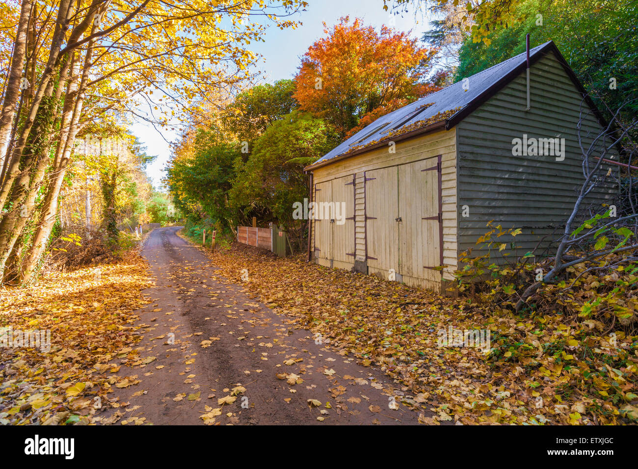 Autumn landscape with road and a barn, Mt. Macedon, Victoria, Australia Stock Photo