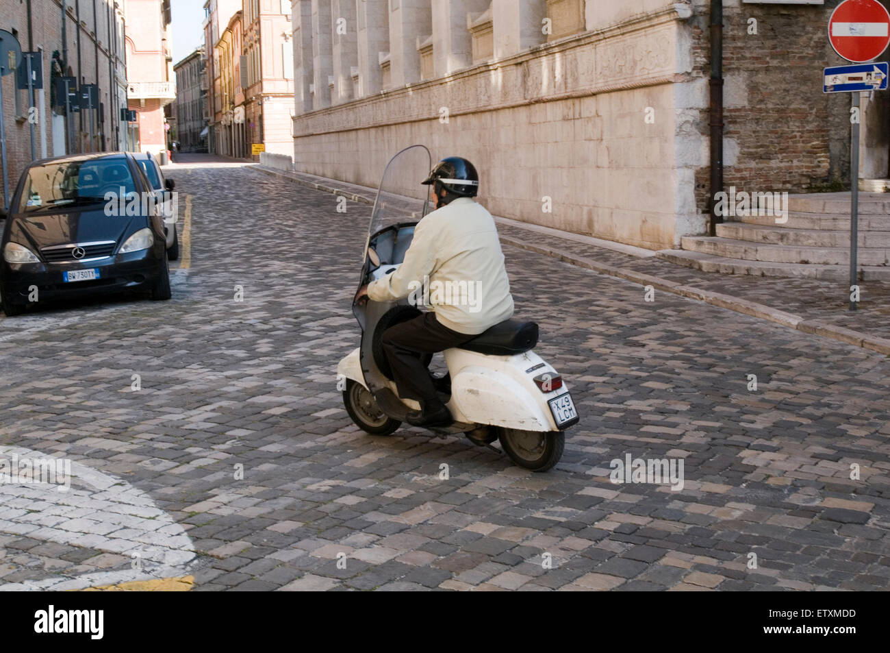 old man riding a scooter moped scooters mopeds italy italian town vespa lamberetta Stock Photo