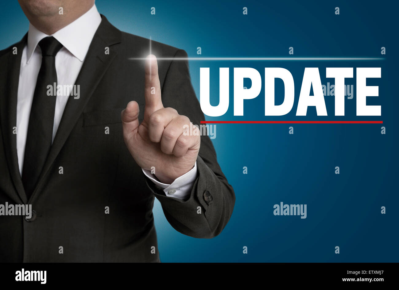 Update touchscreen is operated by businessman. Stock Photo