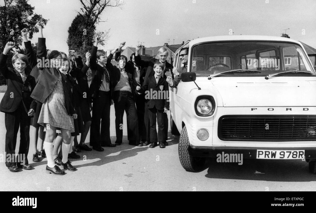 The headmaster of the Blue Coat School, Coventry, Mr W.J Grimes, tries out the new 12-seater bus to the cheers of some of the pupils who helped to raise the money for it. They raised the £1,400 in one day by various sponsored activities during the easter Stock Photo