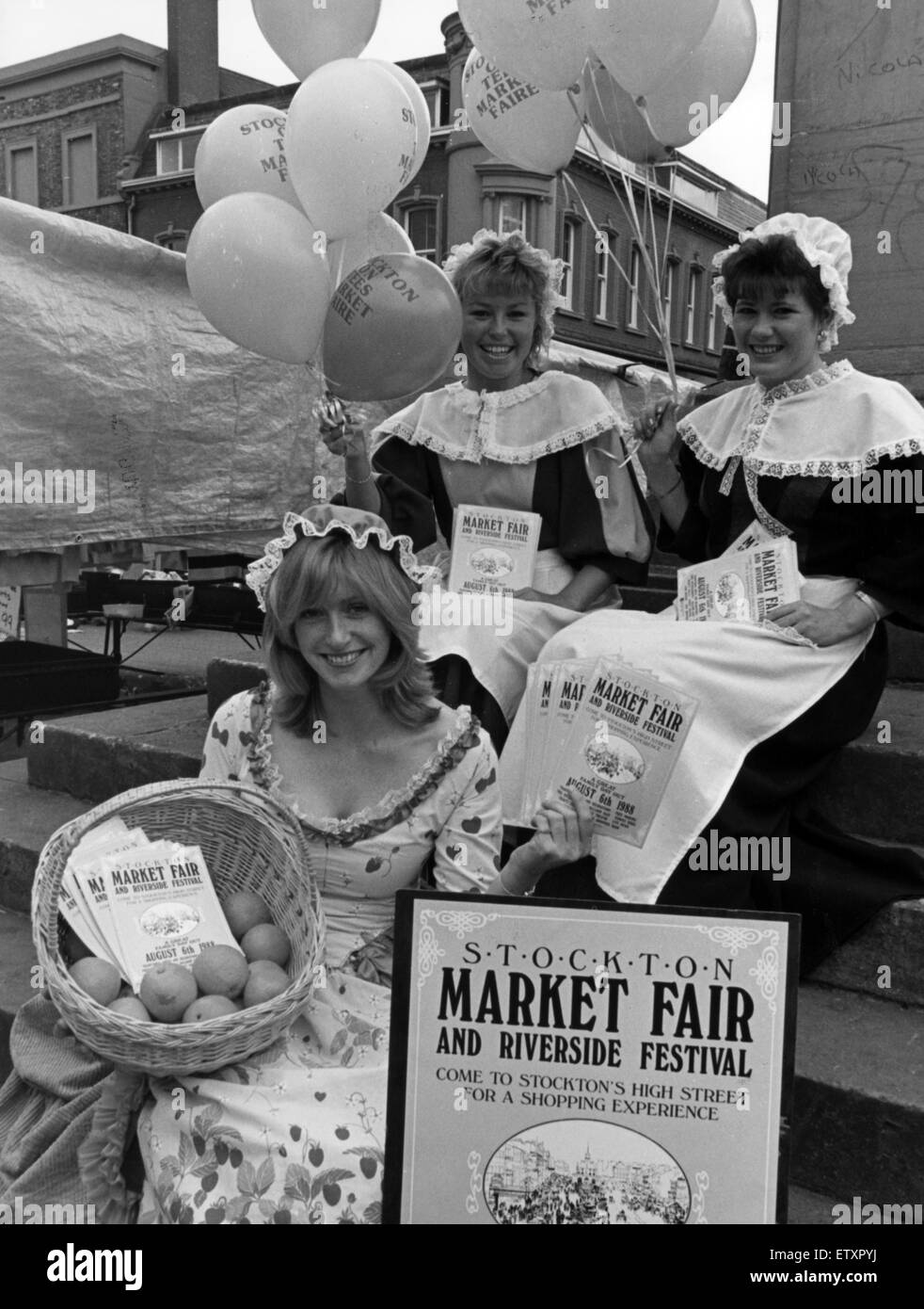 A trio of orange sellers dressed as Nell Gwynne, mingled with stall holders and shopers, handing out their wares and making sure everybody knew about the towns annual market fair. Stockton Market, North East England, 3rd August 1988. Left to Right, Christ Stock Photo
