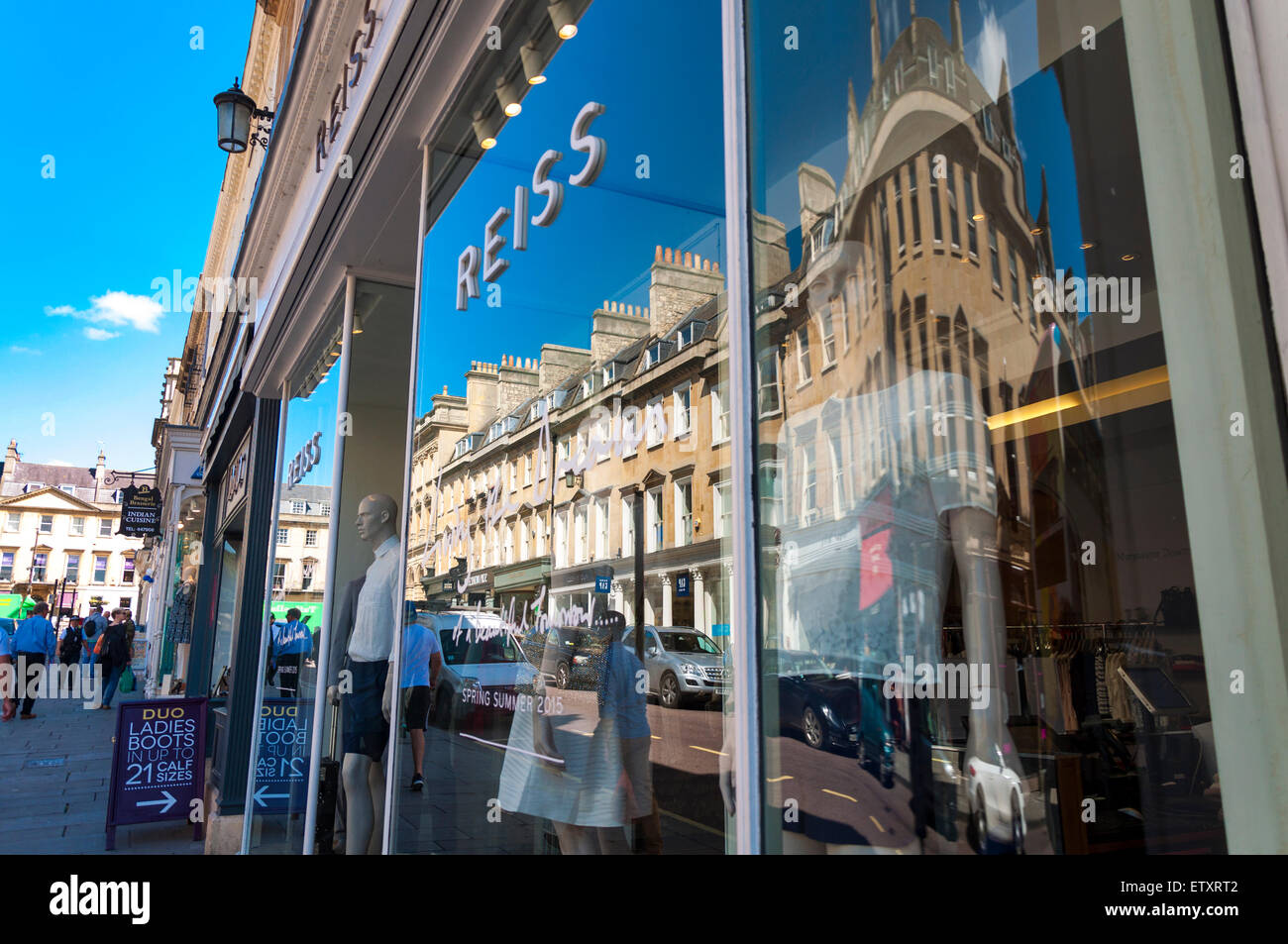Reflections of shops on Milsom Street, Bath, Somerset, UK Stock Photo