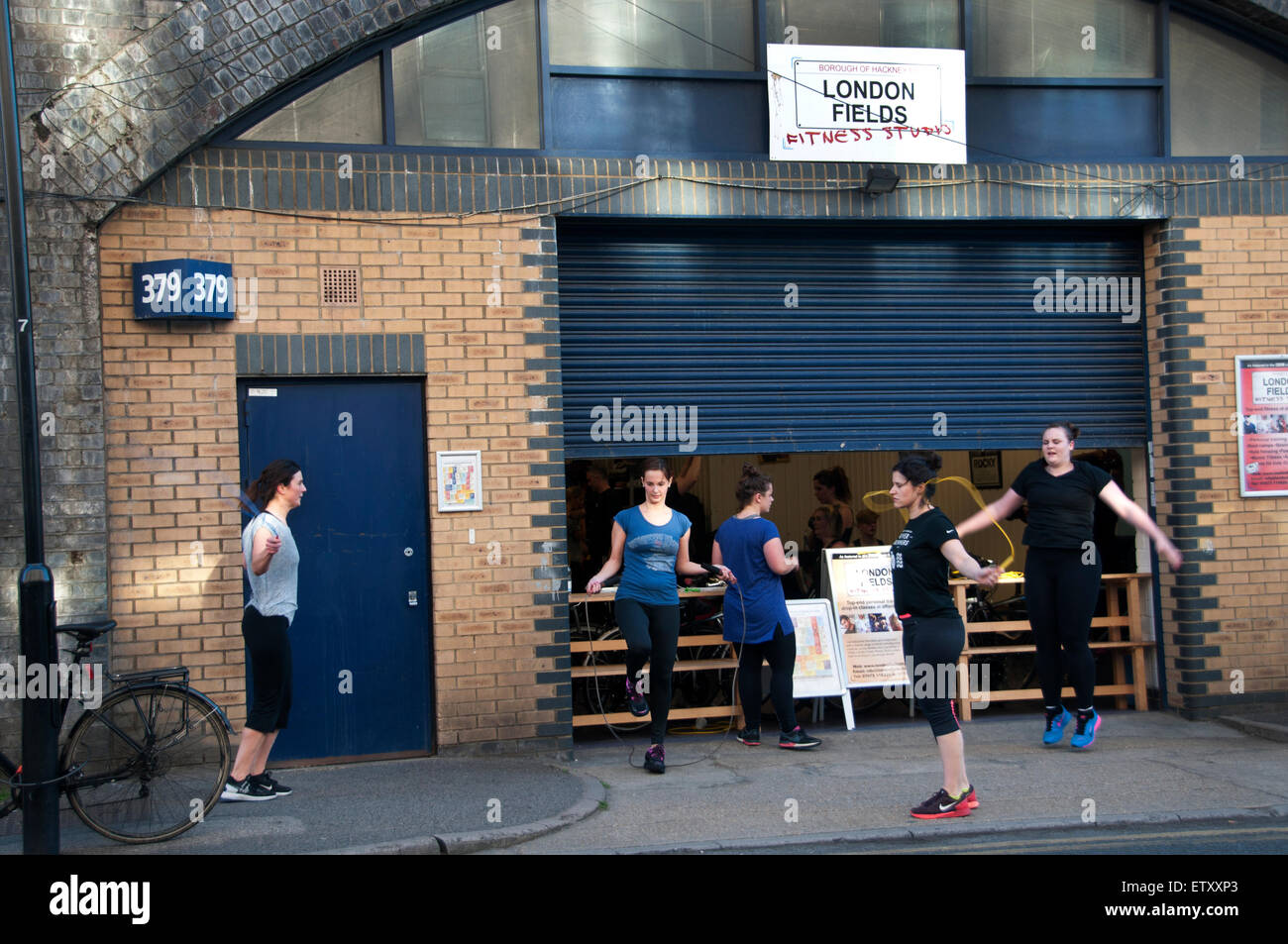 Hackney, London. London Fields. The Arches.People skip whilst they wait for their gym class. Stock Photo