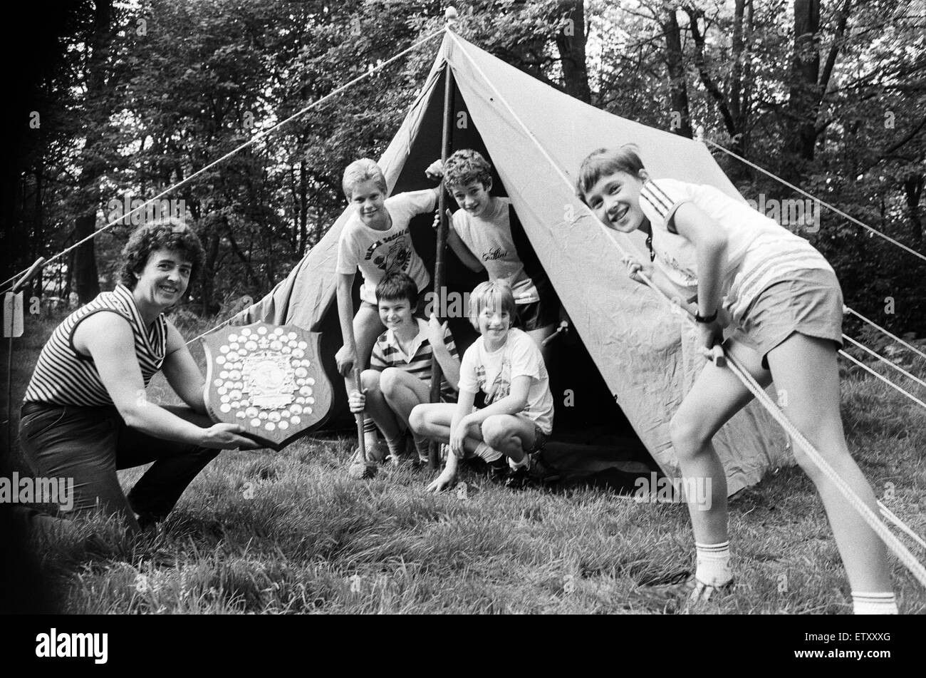 County scout secretary Mrs Margaret Hunter shows off the winner's shield to members of the 15th Cowcliffe Spider patrol, who were taking part in the annual inter-district camping competition at Bradley Wood. The Cowcliffe team - Steven Cresswell, Michael Stock Photo