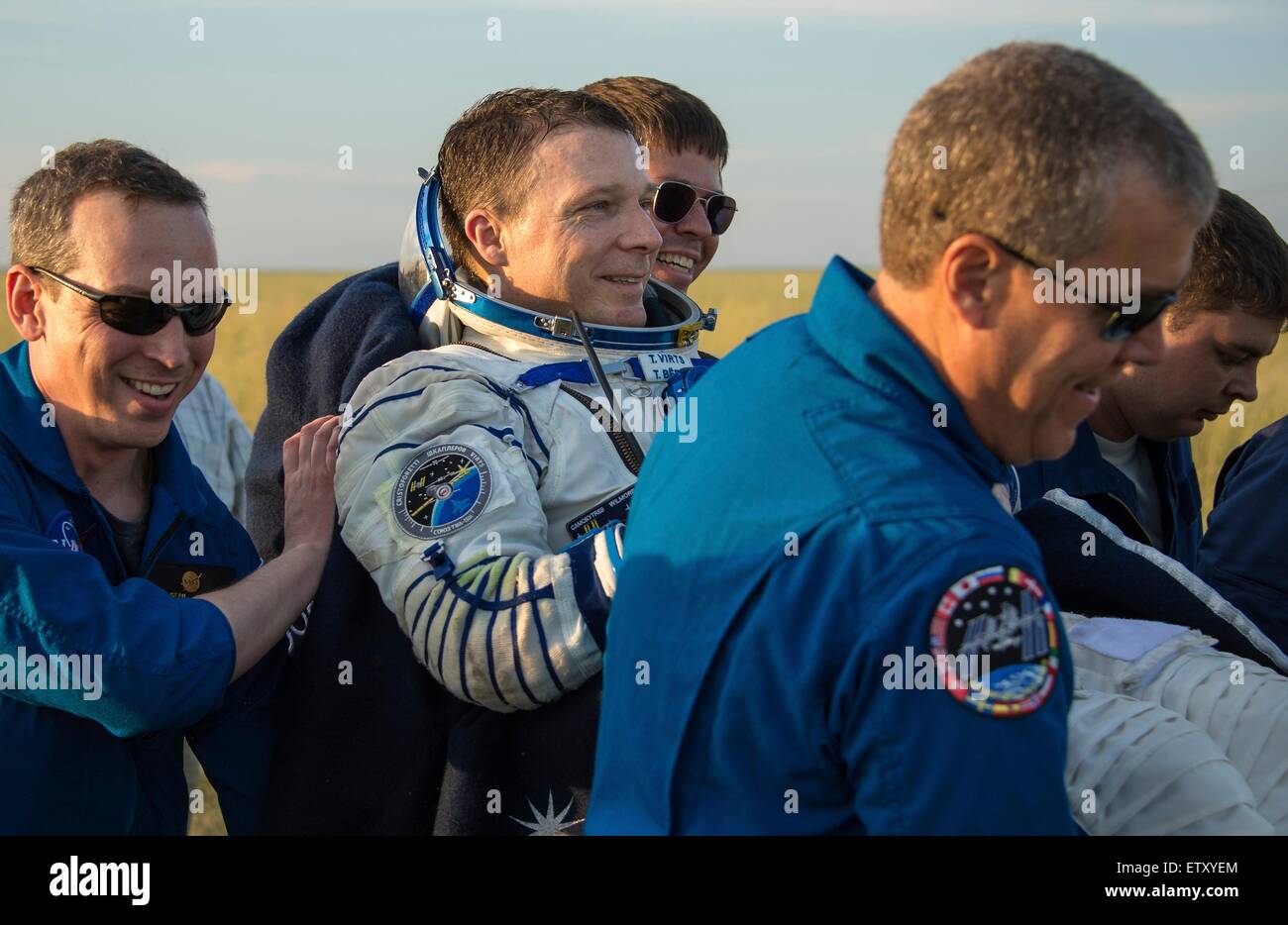 International Space Station Expedition 43 crew member American Terry Virts of NASA is carried to the medical tent moments after landing in a remote area in the Soyuz TMA-15M spacecraft June 11, 2015 near Zhezkazgan, Kazakhstan. The crew is returning after more than six months onboard the International Space Station. Stock Photo