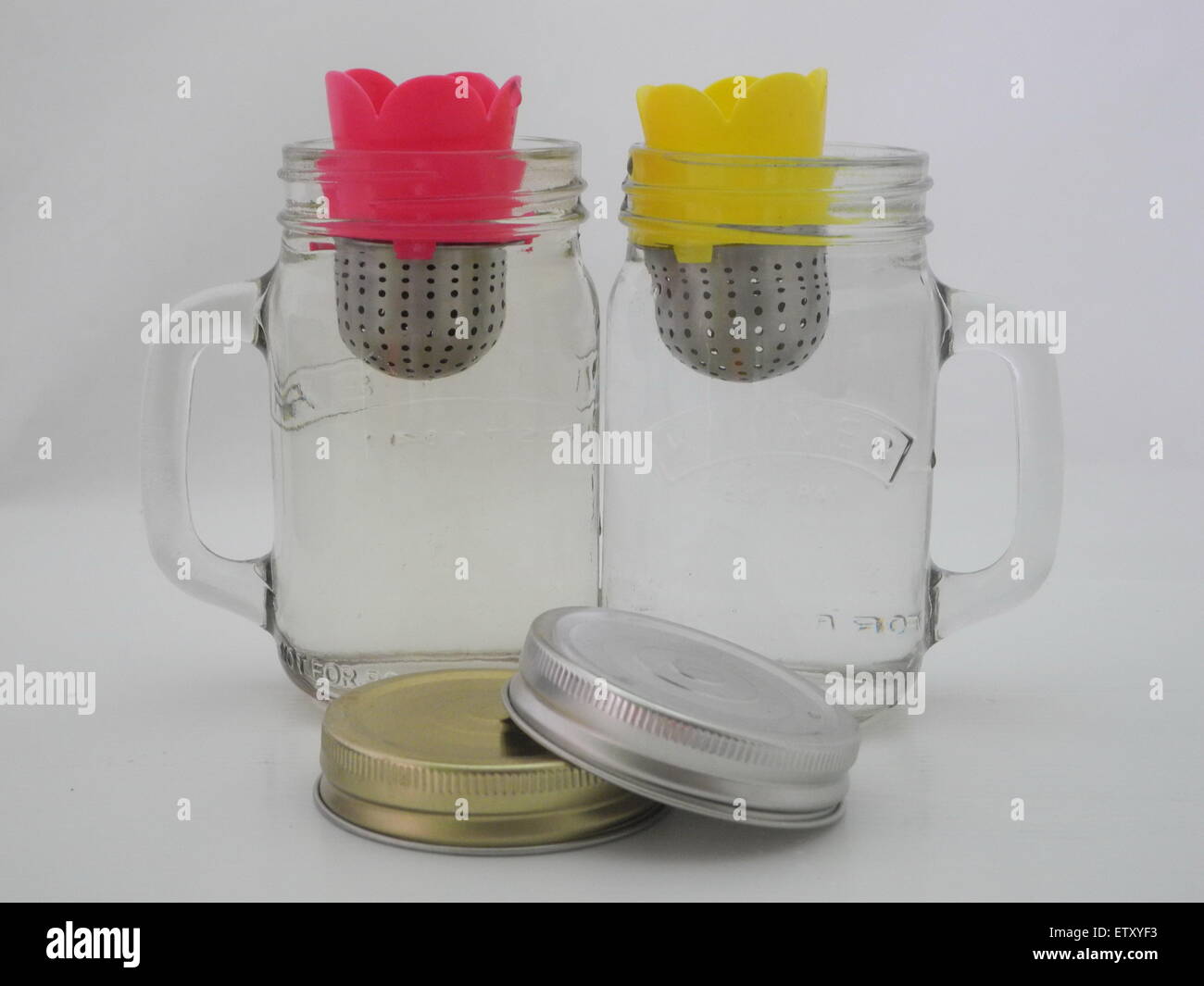 The maker tea in a jar of water on a white background . Stock Photo