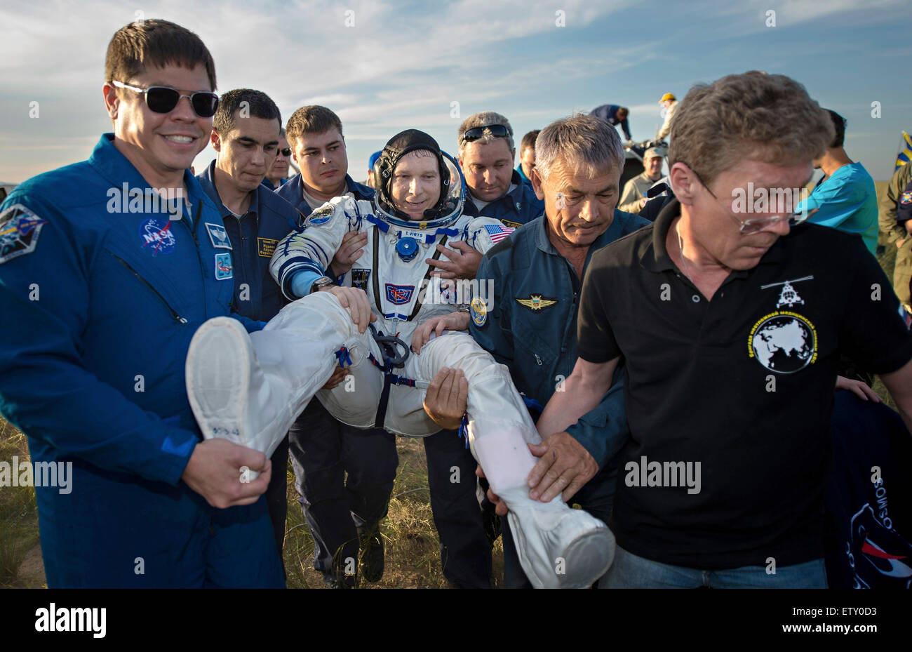 International Space Station Expedition 43 crew member American Terry Virts of NASA is carried to the medical tent moments after landing in a remote area in the Soyuz TMA-15M spacecraft June 11, 2015 near Zhezkazgan, Kazakhstan. The crew is returning after more than six months onboard the International Space Station. Stock Photo