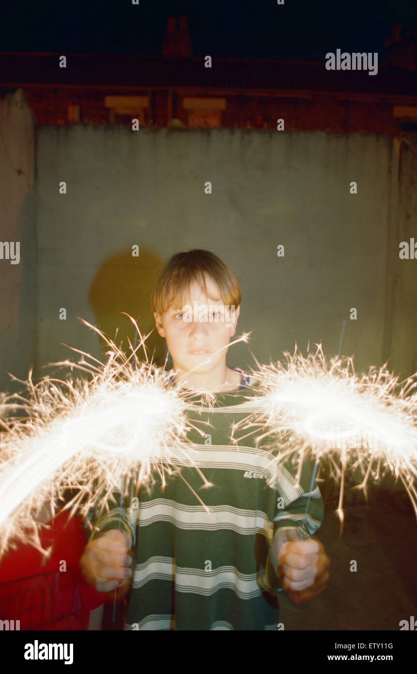 Teenage boy with Fireworks, 28th October 1994 Stock Photo Alamy