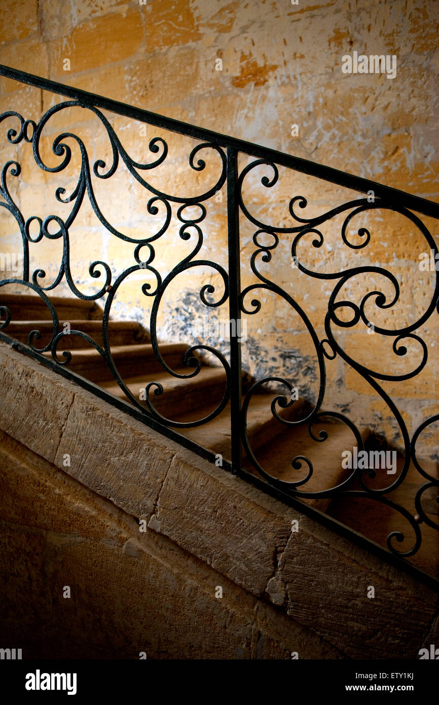 Wrought iron handrail of and old staircase Stock Photo - Alamy