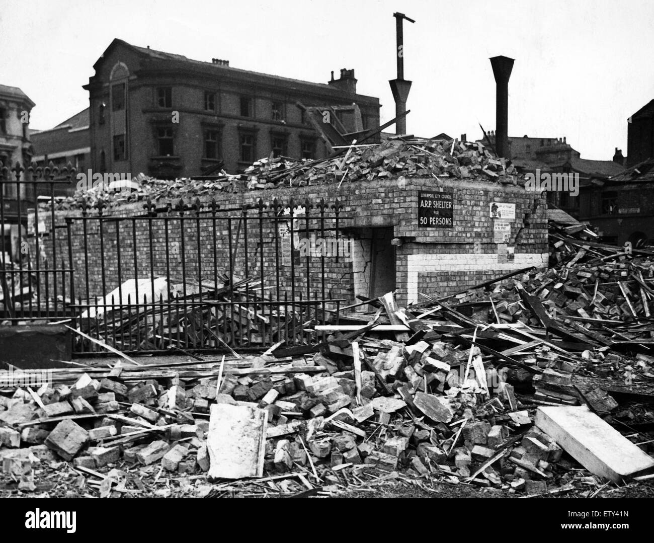 Bomb damage in Liverpool during the Second World War. A street surface shelter which withstood the strain of a tall building which fell upon it during the weekend raids. 2nd September 1940. Stock Photo