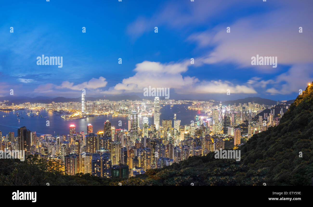 Night skyline of Hong Kong and Victoria Harbour from The Peak on a clear day Stock Photo