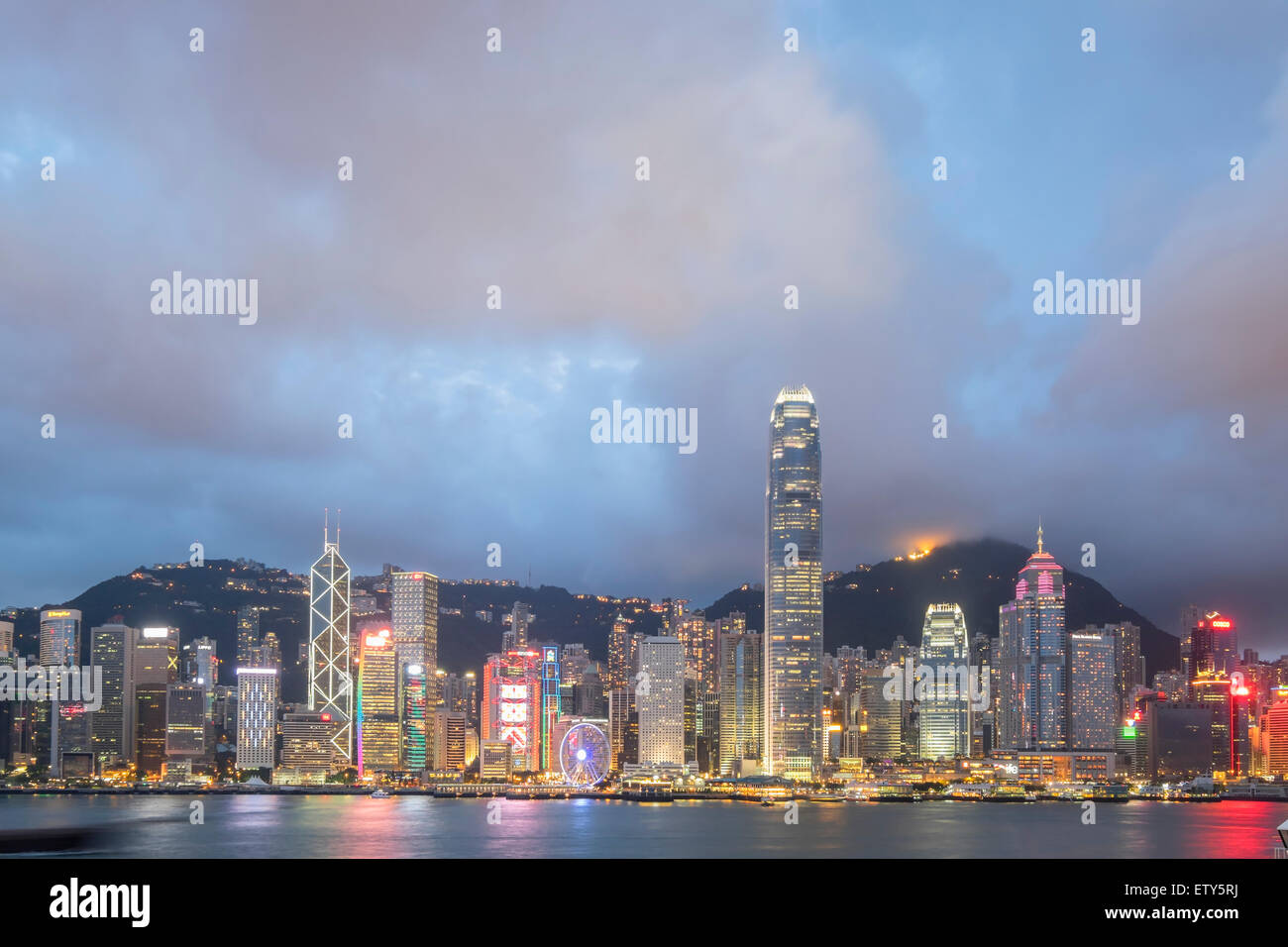 Dusk skyline of skyscrapers in Hong Kong from Kowloon on a clear day Stock Photo