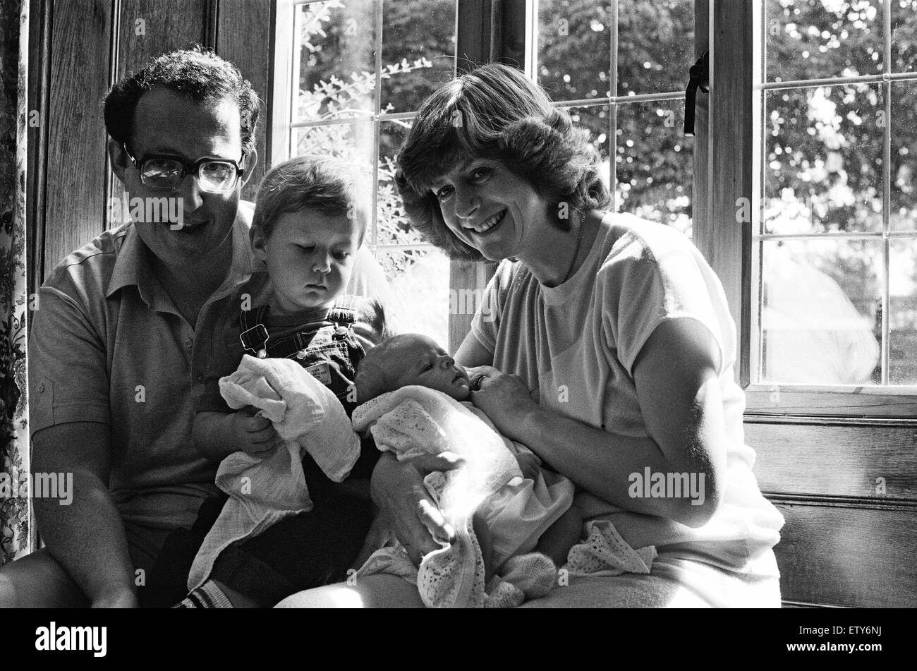 Poet Pam Ayres is pictured with her newborn baby James, son William and husband Dudley Russell. 3rd August 1984. Stock Photo