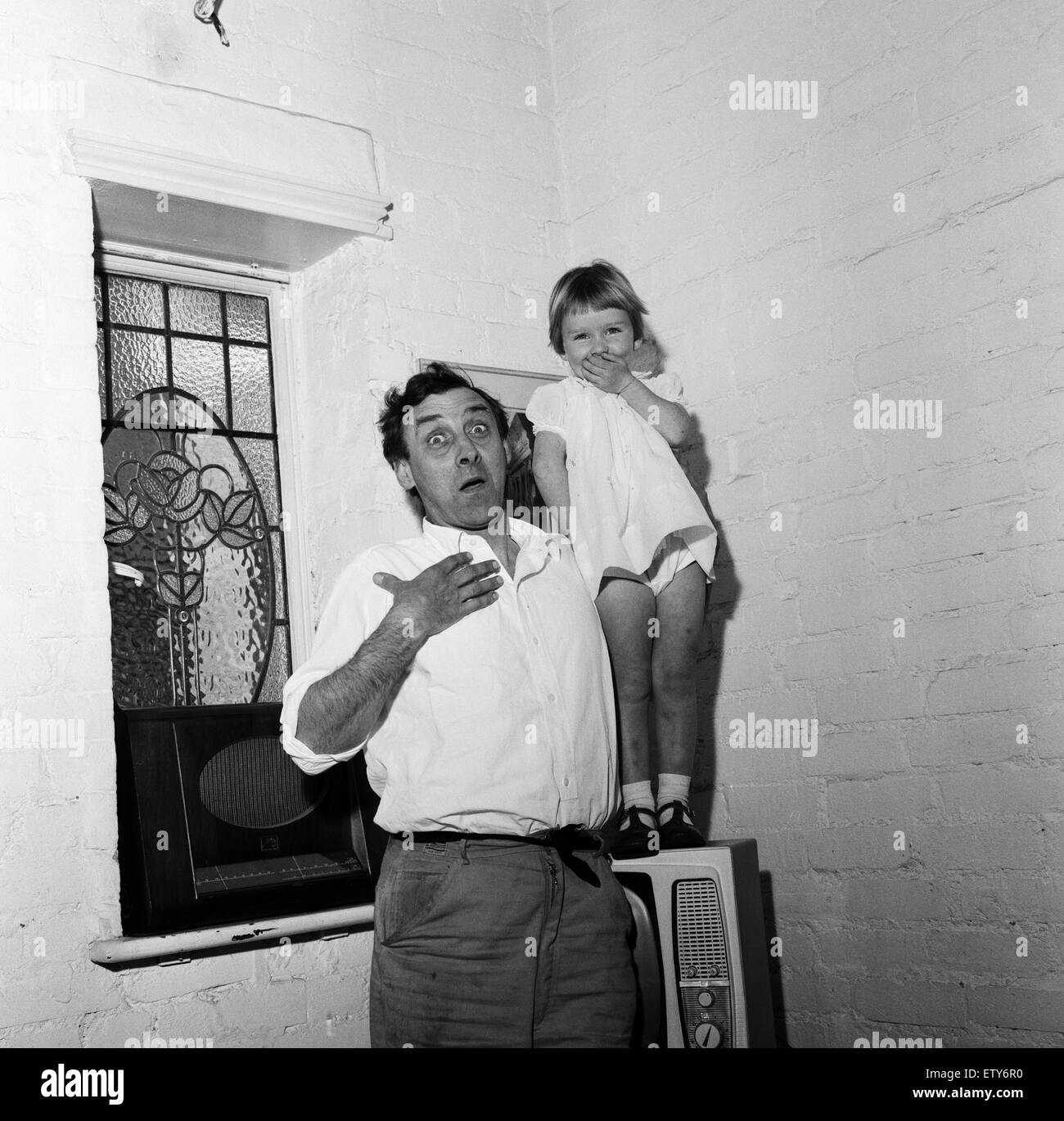 Spike Milligan with his three year old daughter Sile Milligan, pulling funny faces. 16th June 1961. Stock Photo