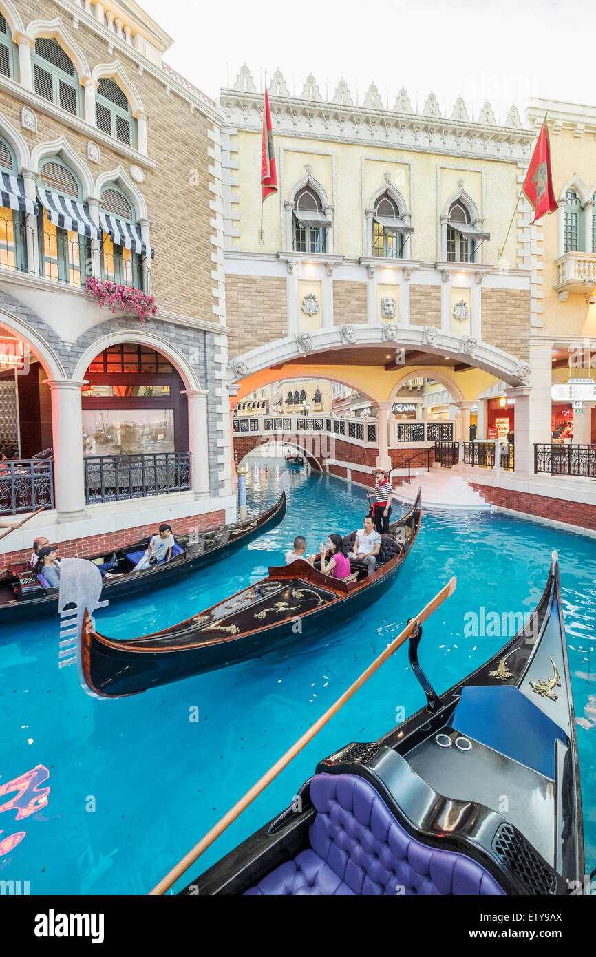 Canal and Gondolas on canal inside The Venetian Macao  casino and hotel in Macau China Stock Photo