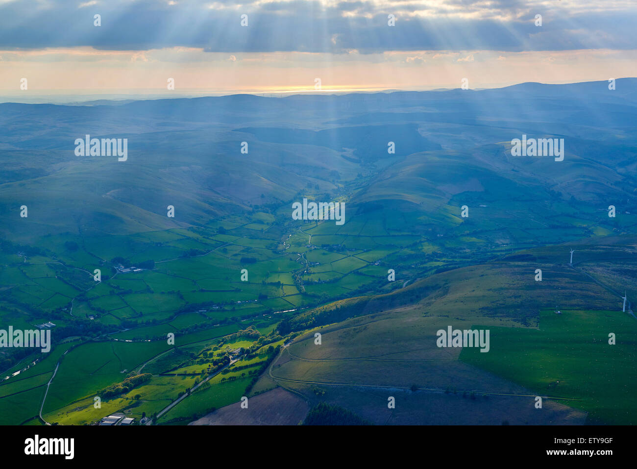 Evening sun setting over Welsh hills, Mid Wales, shot from the air, south of Newtown Powys Stock Photo