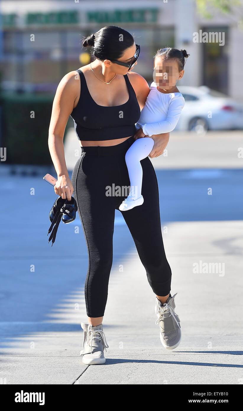 Kim Kardashian is back to black hair as she and Kourtney take their kids to  ballet in Woodland Hills. Kim sporting a pair of Adidas Yeezy Boost  sneakers designed by Kanye West