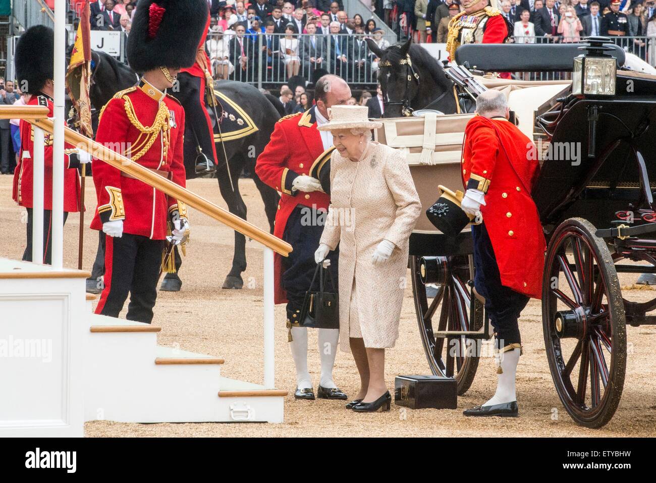 Queen Elizabeth II arrives by carriage for the annual Trooping the Colour parade marking her official birthday on Horse Guards Parade June 13, 2015 in London, England. Stock Photo