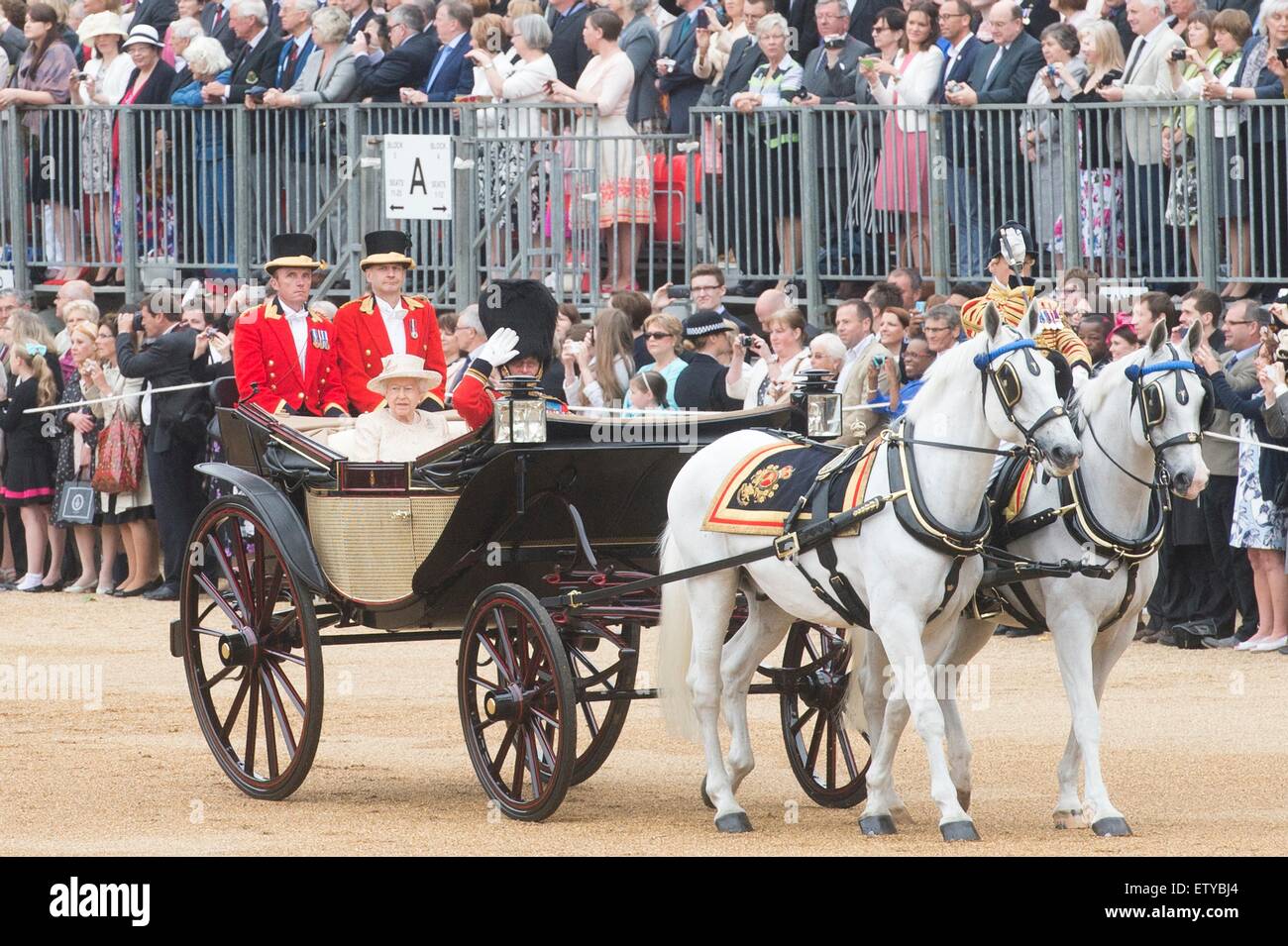 Queen Elizabeth II and Prince Philip arrives by carriage for the annual Trooping the Colour parade marking her official birthday on Horse Guards Parade June 13, 2015 in London, England. Stock Photo