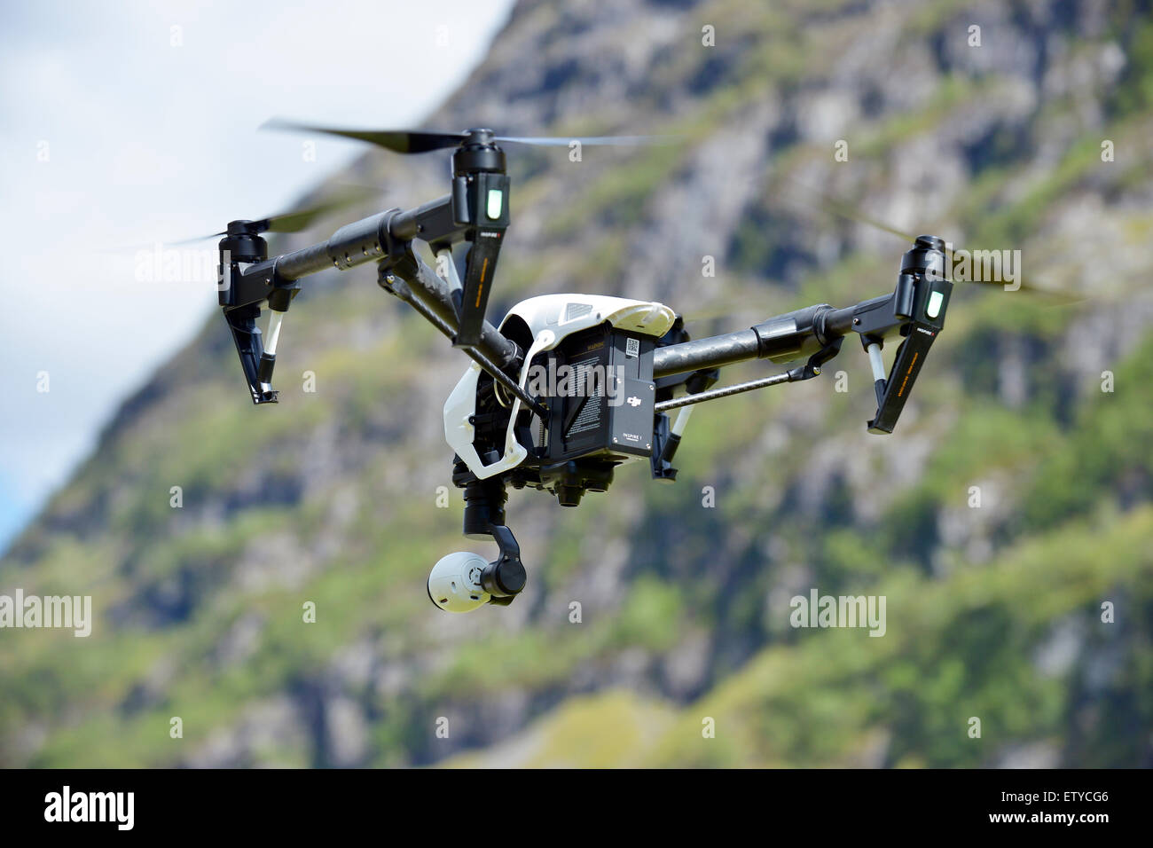 Drone with camera flying Stock Photo