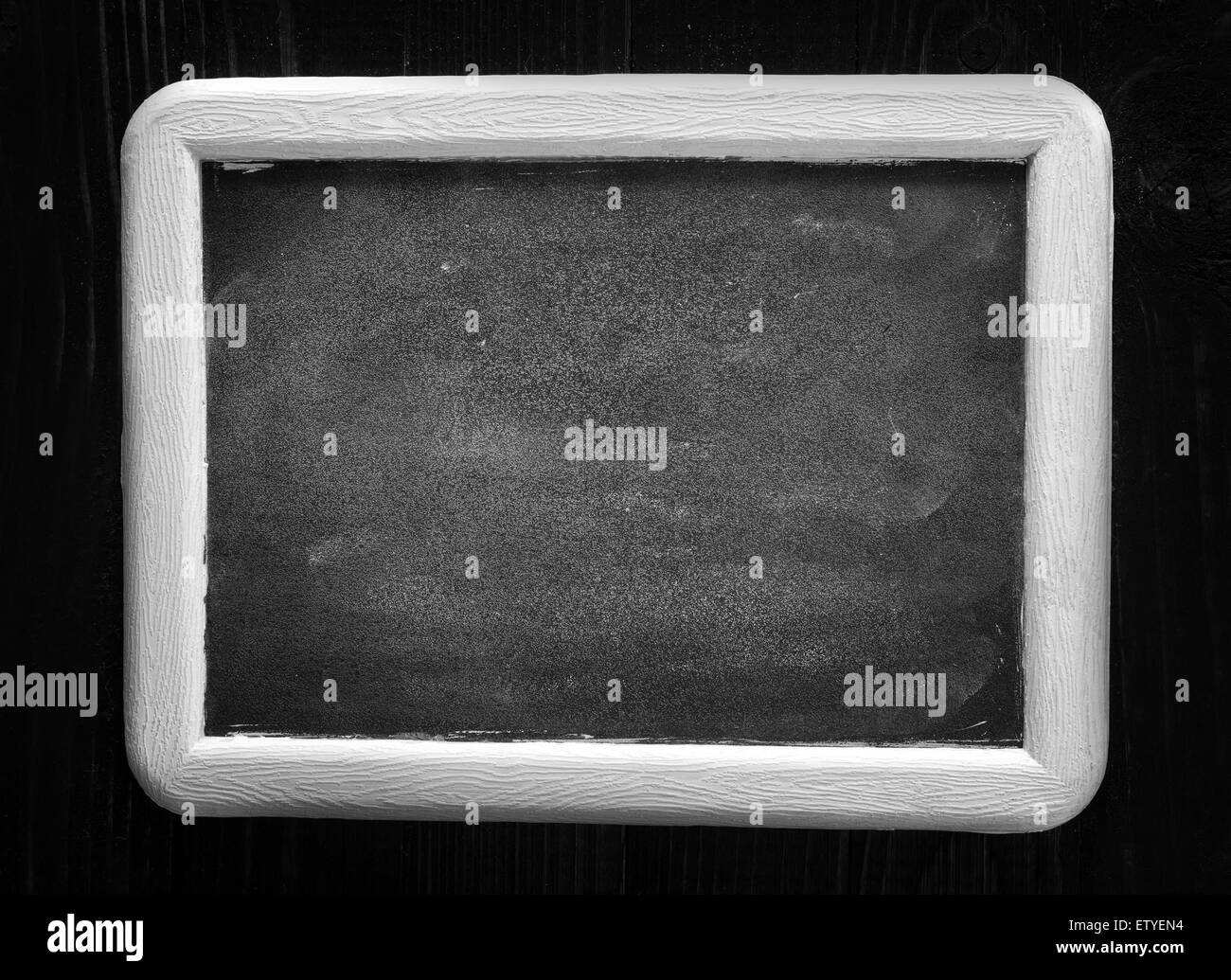 black board and white chalk on a table Stock Photo Alamy