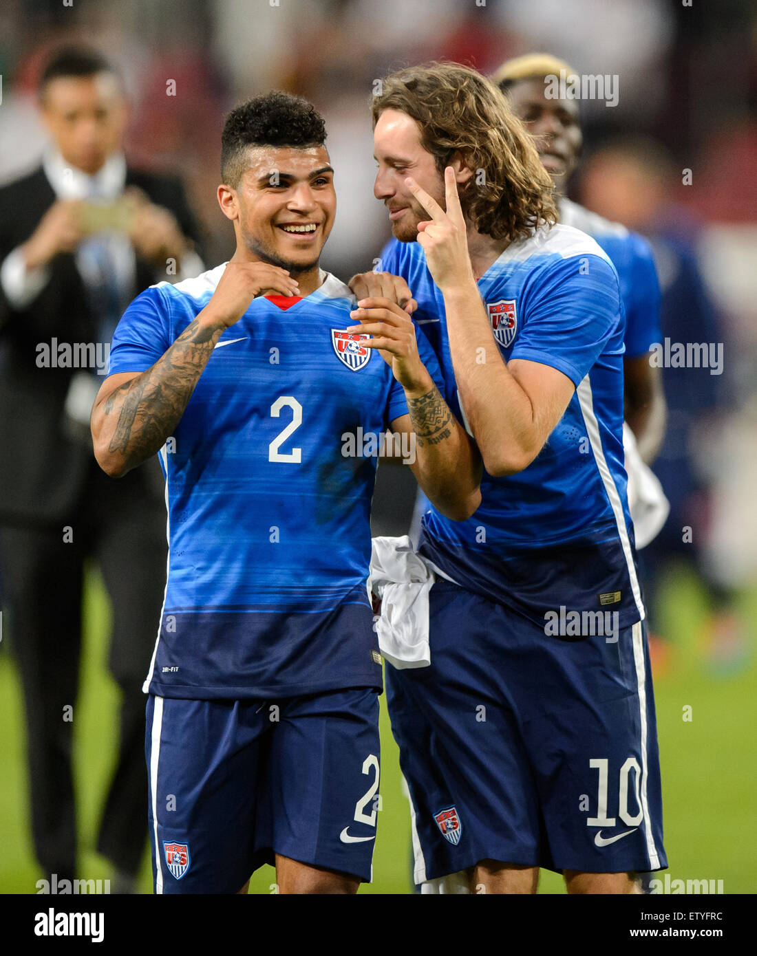 Cologne, Germany. 10th June, 2015. DeAndre Yedlin (L) and Mix Diskerud of the USA celebrate after the international friendly soccer match between Germany and the USA at RheinEnergieStadion in Cologne, Germany, 10 June 2015. The USA won the match 2-1. Photo: Thomas Eisenhuth/dpa - NO WIRE SERVICE -/dpa/Alamy Live News Stock Photo