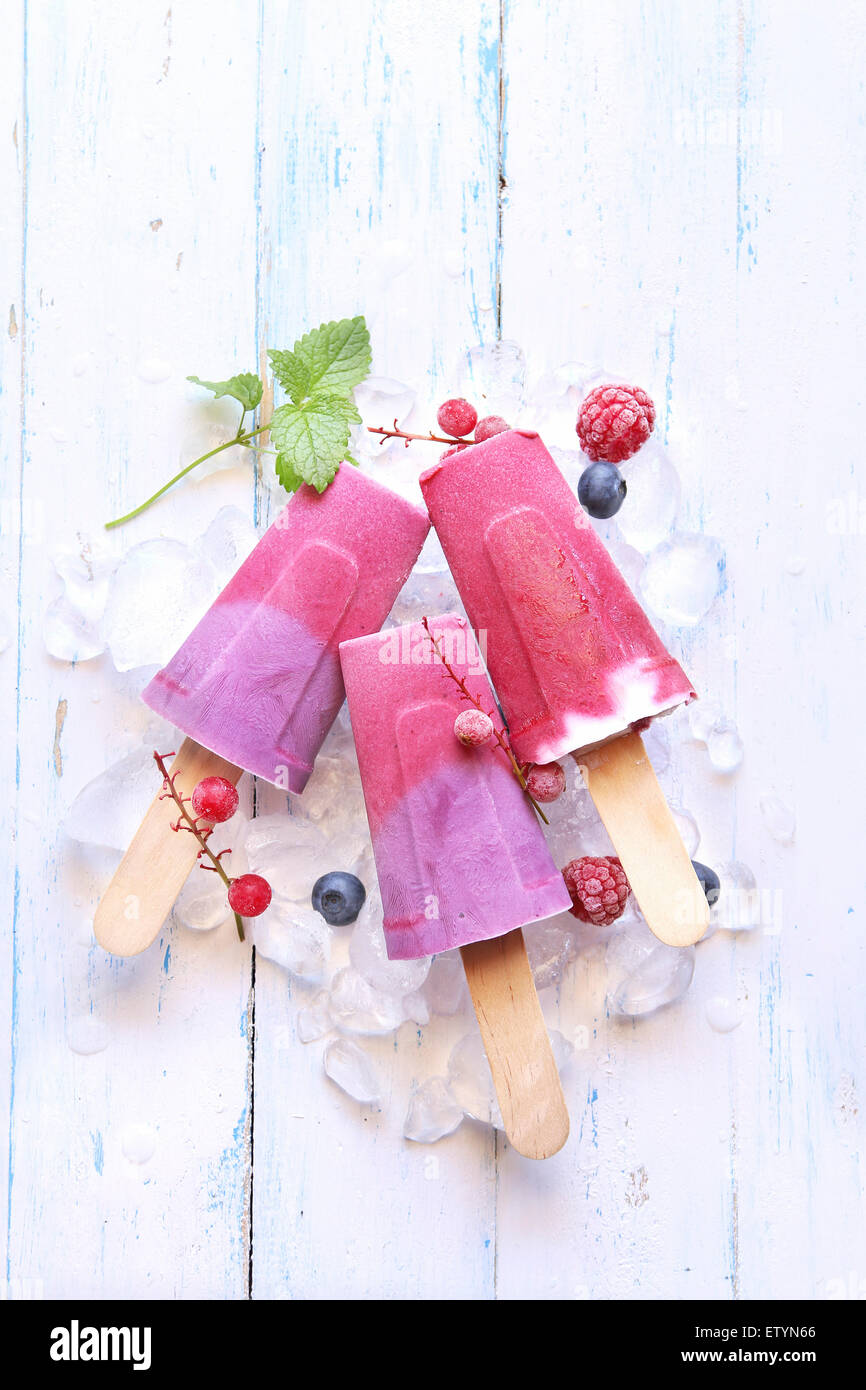 Summer ice cream popsicles with blueberry, raspberry and yogurt Stock Photo