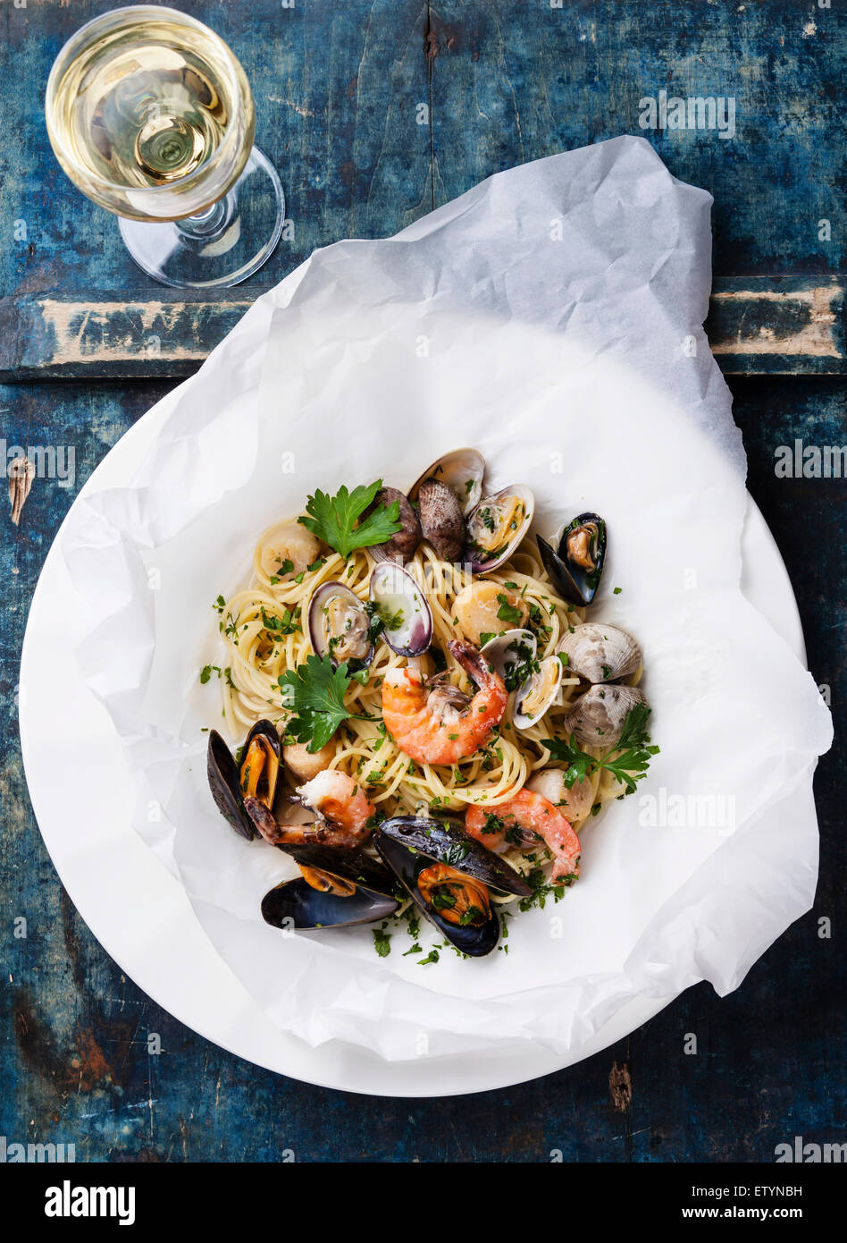 Seafood pasta and wine Spaghetti with clams, prawns, sea scallops on