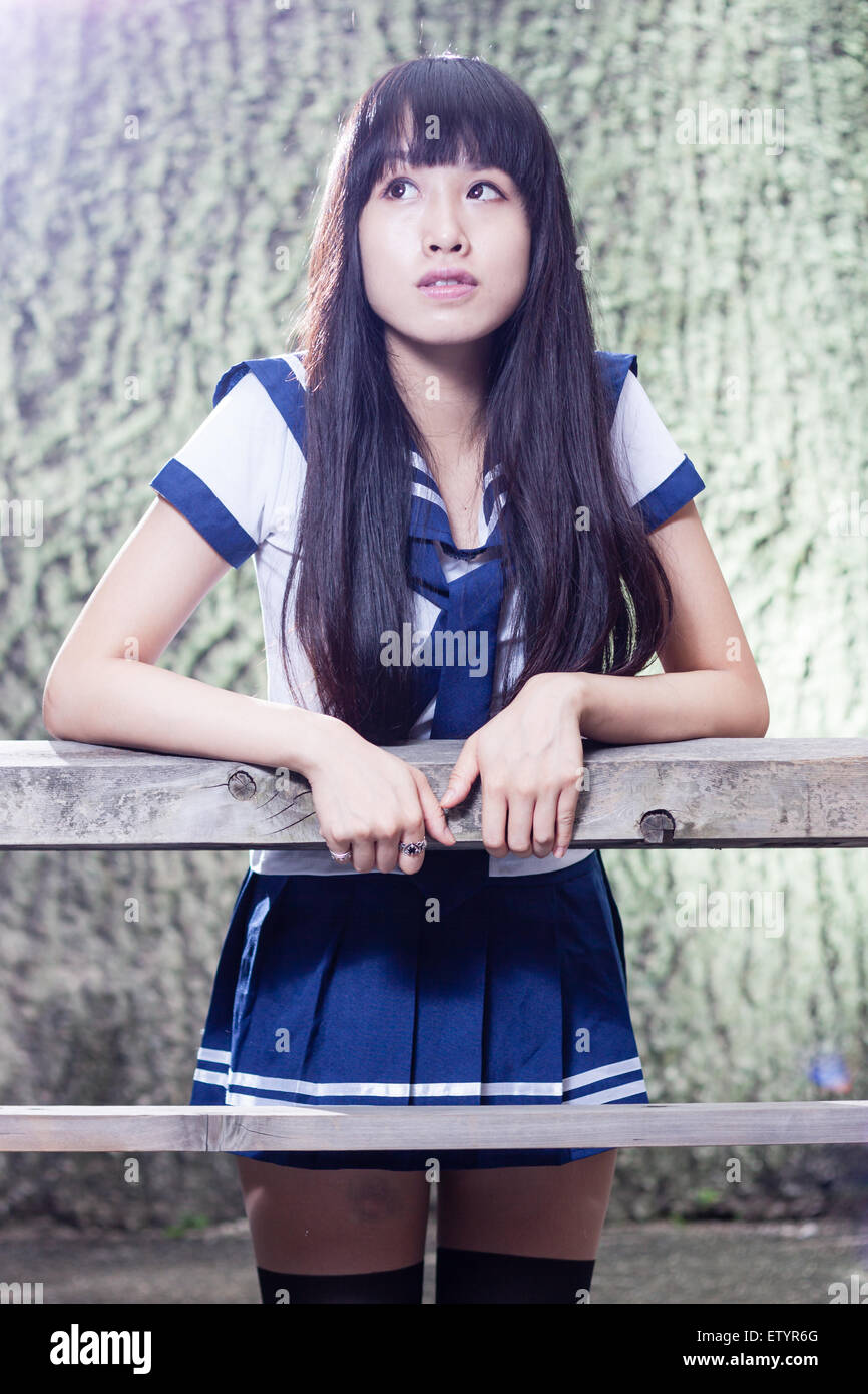 chinese schoolgirls Pretty Chinese high school girl leaning on wooden fence Stock Photo - Alamy
