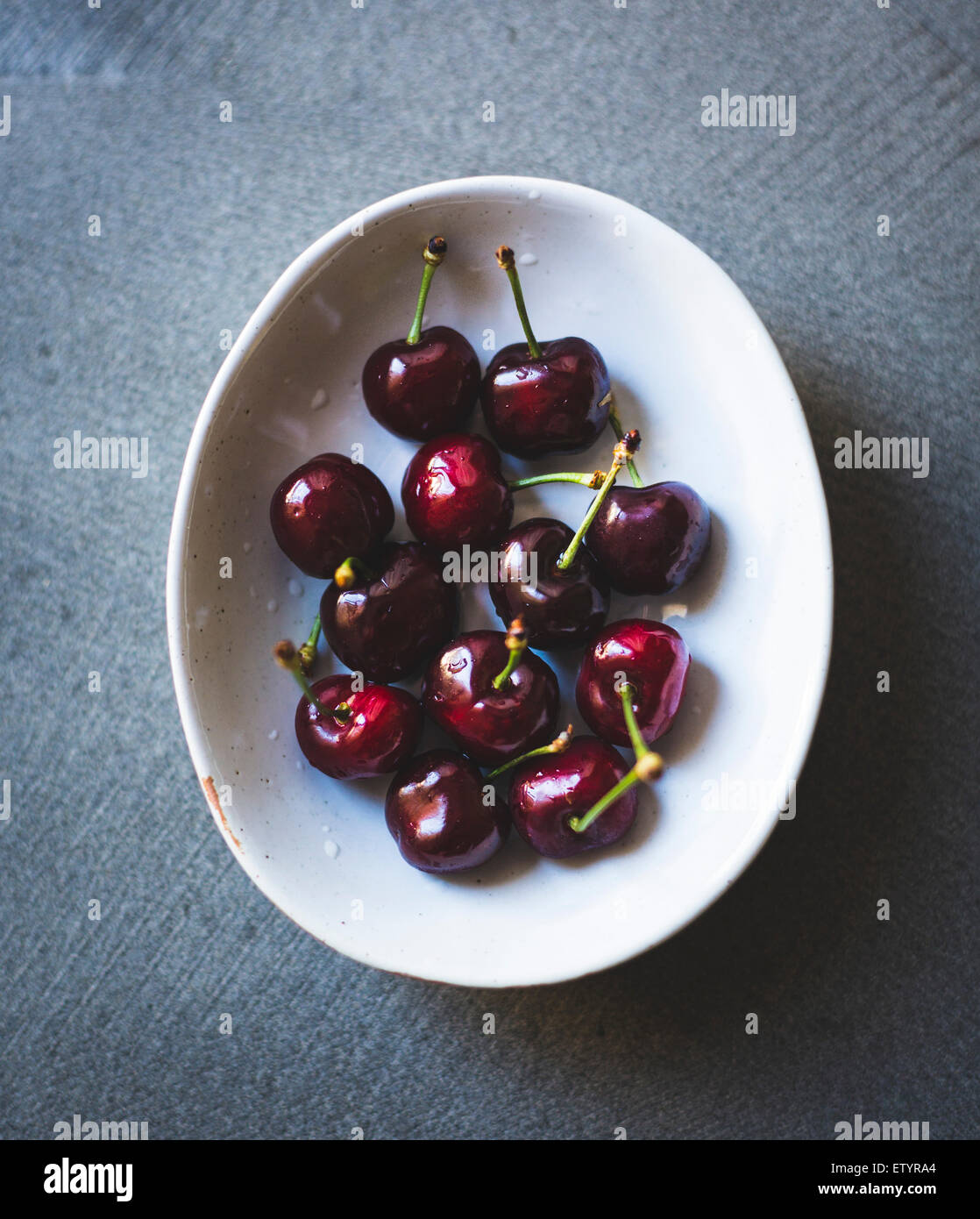 Ripe red cherries in a bowl. Stock Photo