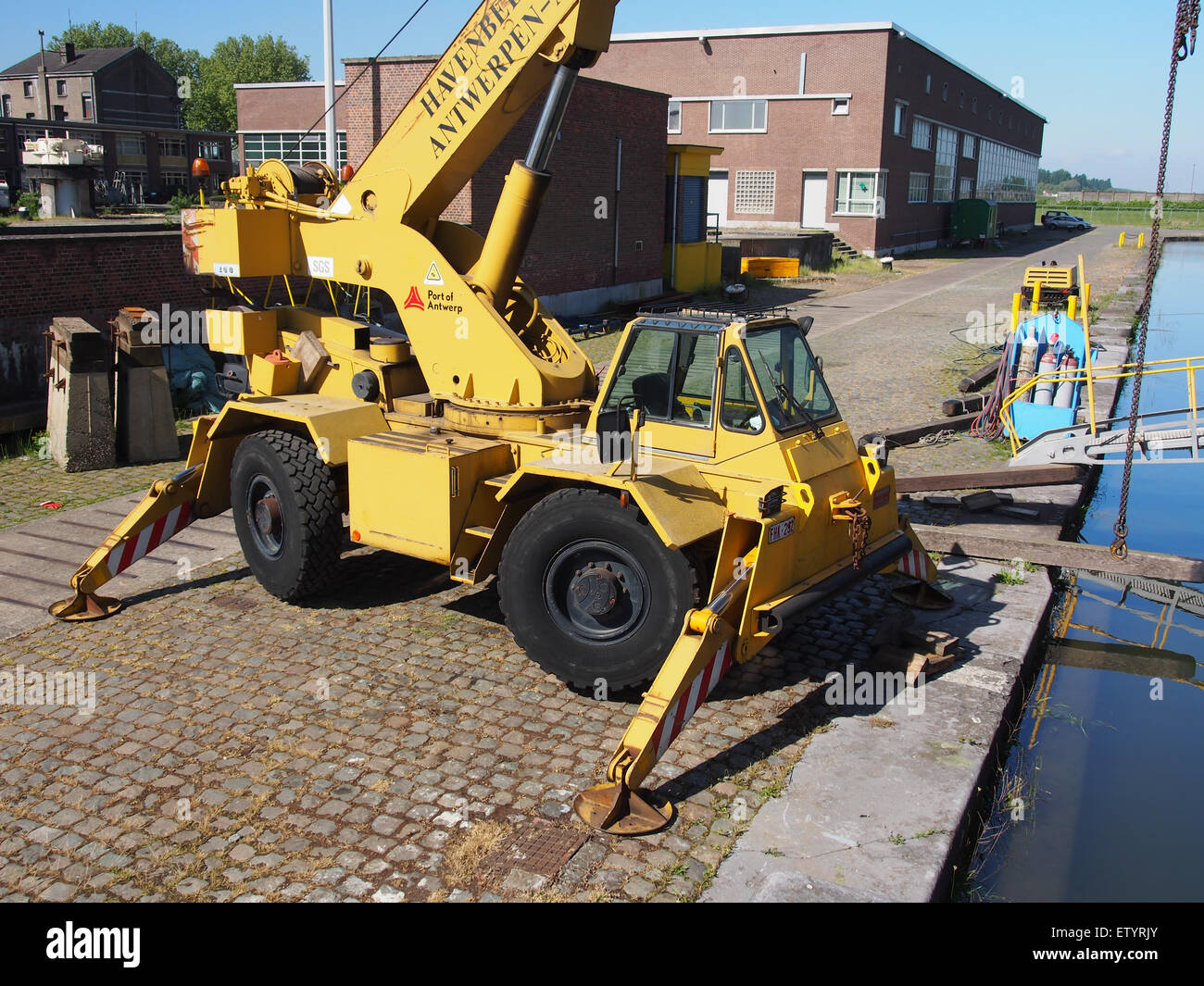 This image features the crane F III Locatelli Grill 168 in the Port of Antwerp, showcasing its role in cargo handling and port operations at one of Europe's largest ports. Stock Photo
