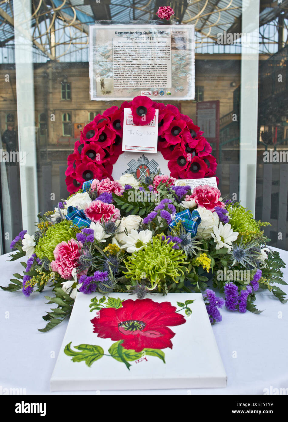 Wreath and floral arrangement commemorating Quintinshill rail disaster on display at Carlisle railway station, Cumbria UK Stock Photo