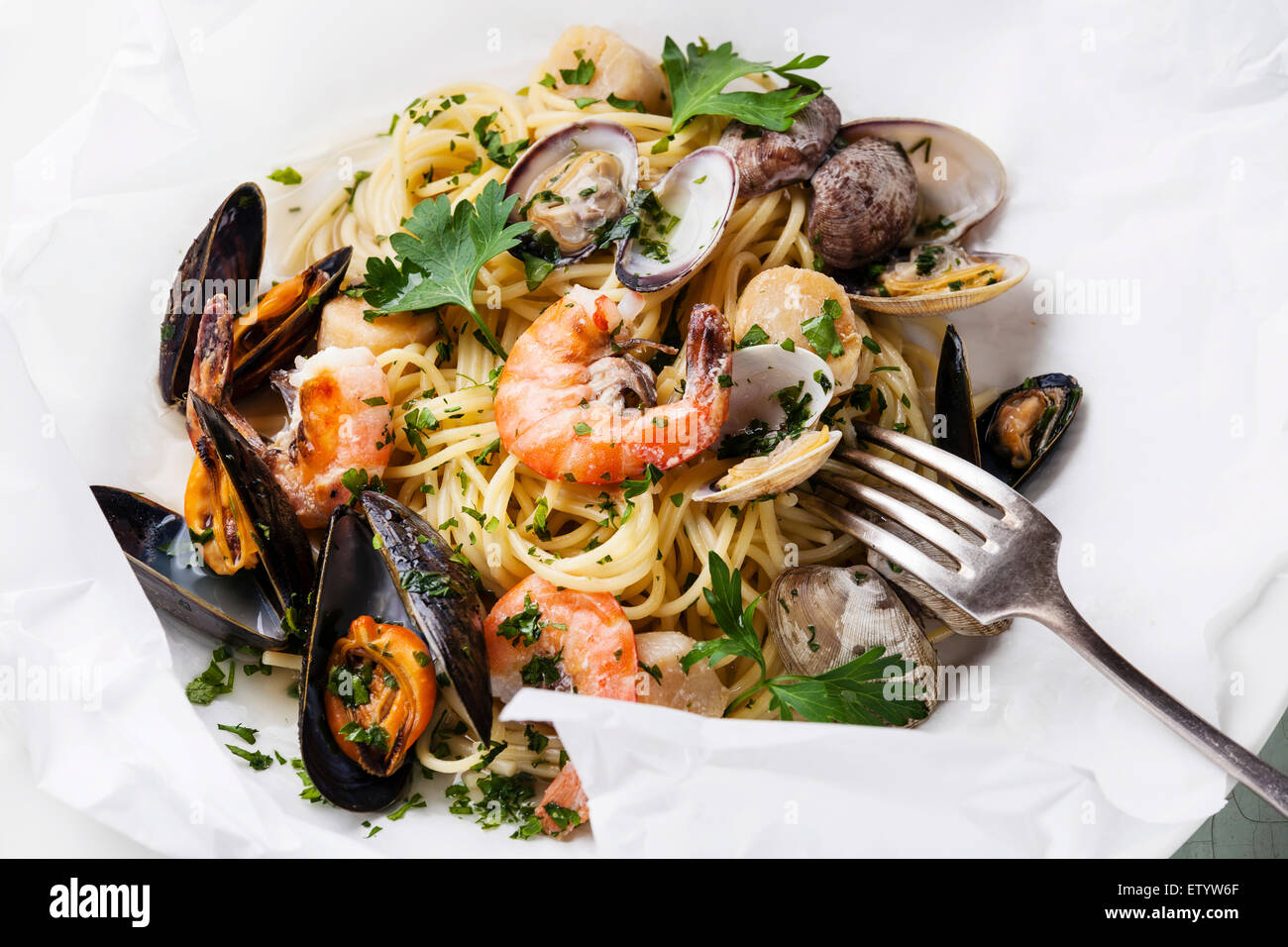 Seafood pasta Spaghetti with clams, prawns, sea scallops on white