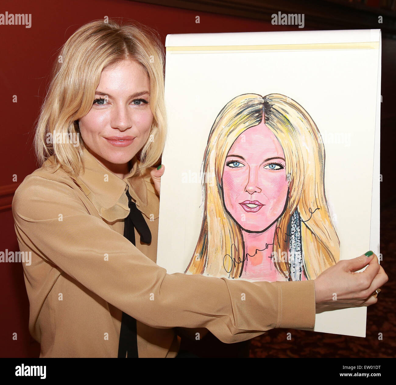 Sienna Miller's caricature portrait unveiling at Sardi's restaurant, a famous theater district eatery  Featuring: Sienna Miller Where: New York City, New York, United States When: 27 Mar 2015 C Stock Photo