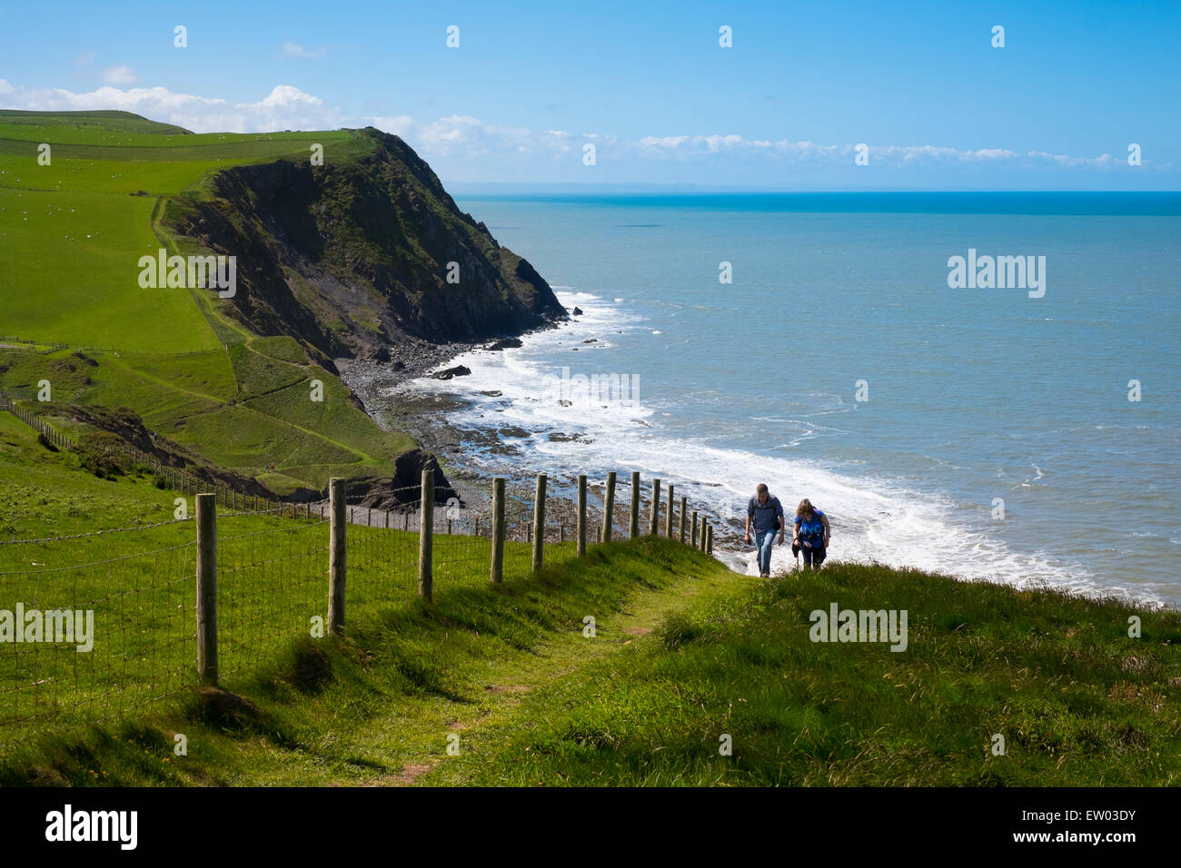 Walkers on the Wales Coast Path near Borth, Ceredigion, Wales Stock Photo