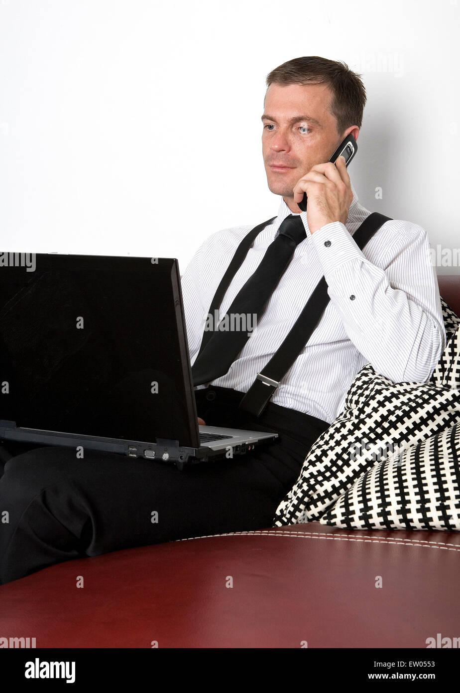 man with his laptop and phone Stock Photo - Alamy