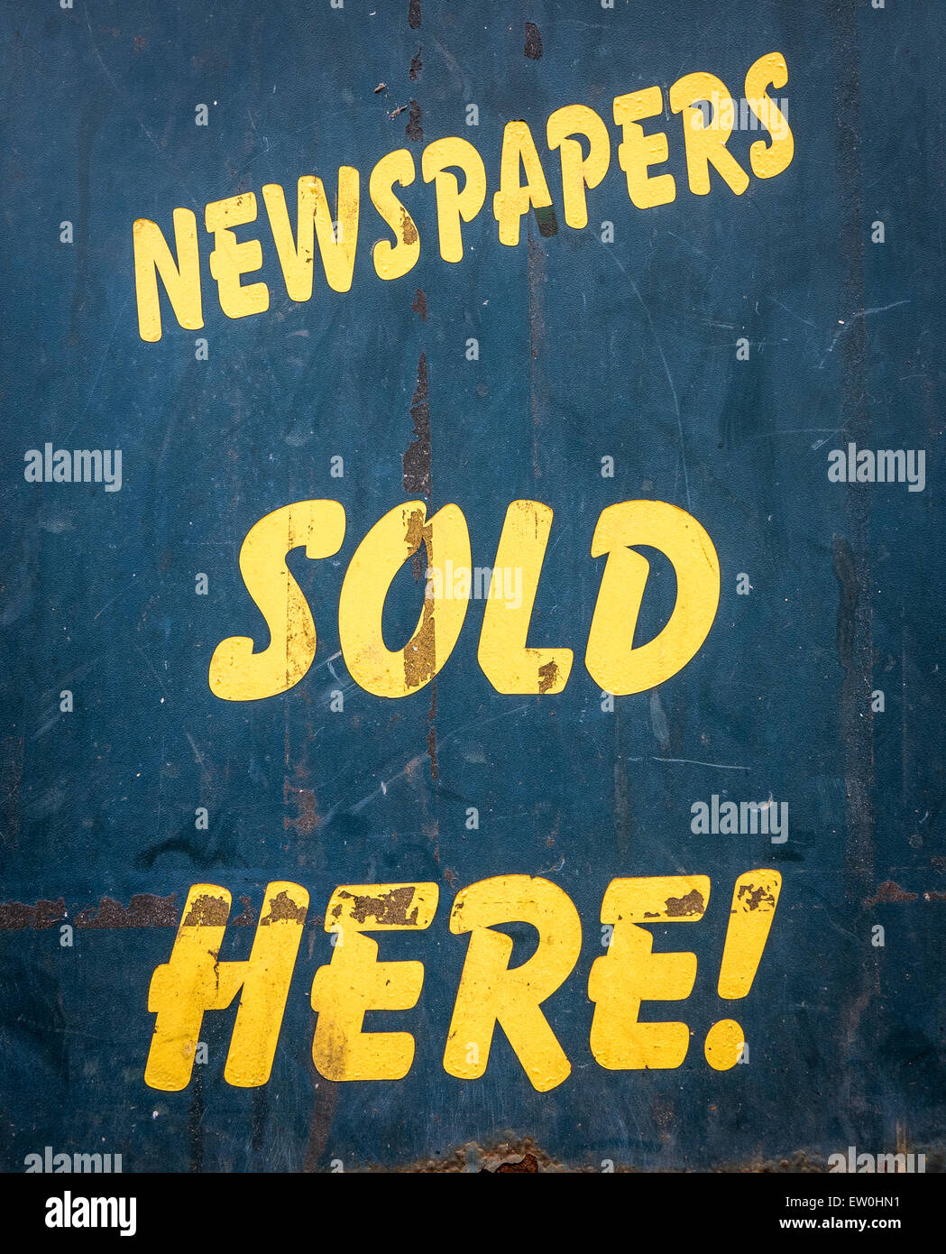 Grungy Old Newspapers Sold Here Sign Outside A Newsagents In The UK