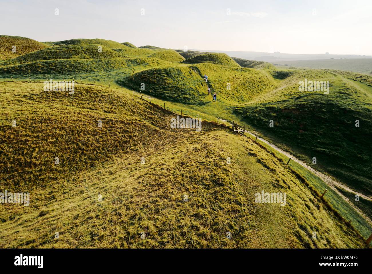 Maiden Castle Iron Age hill fort, Dorset. Four ramparts and three ditches of complex earthwork defences of the western entrance Stock Photo