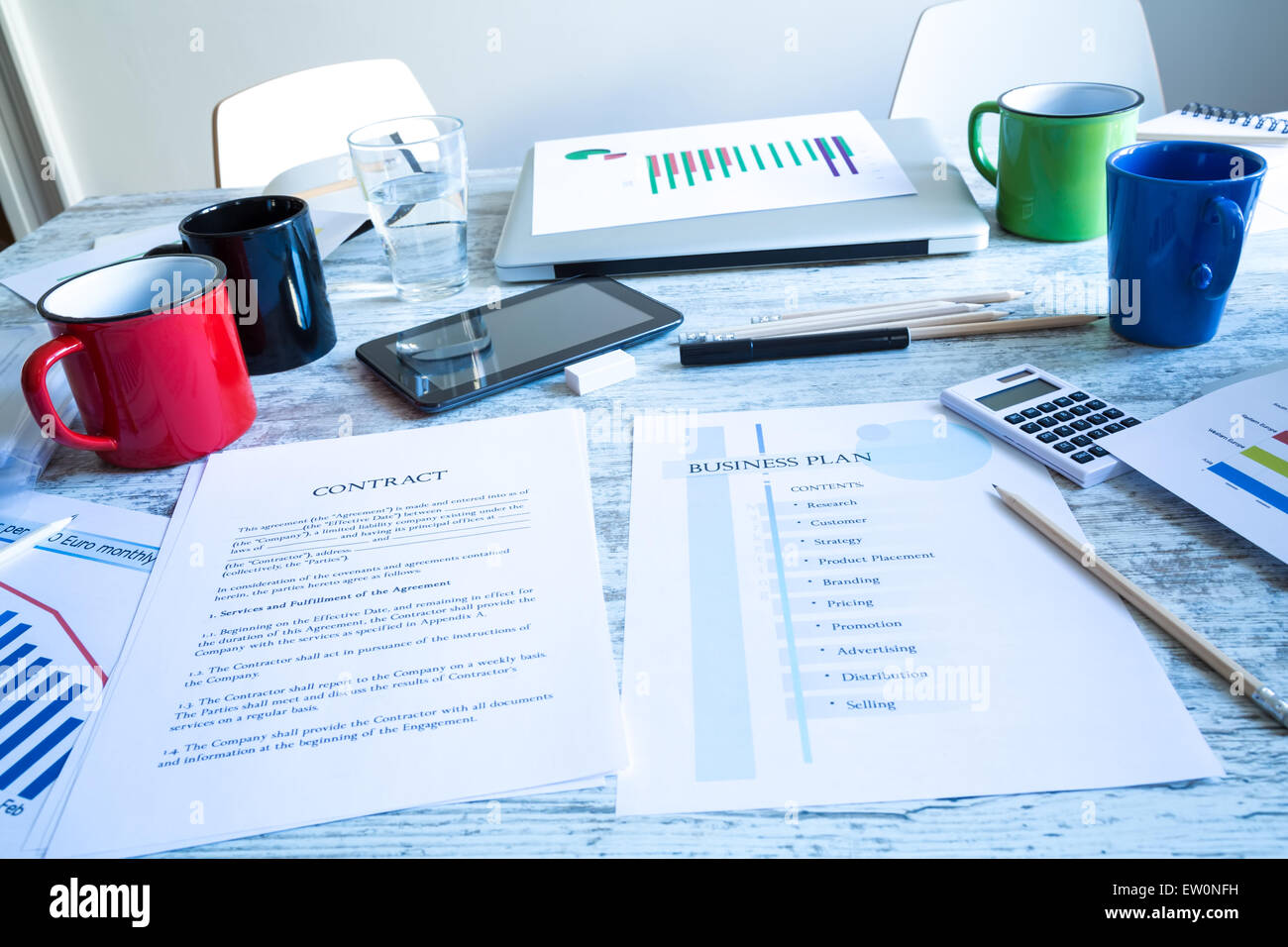 Analyzing a Contract and a Business Plan Stock Photo
