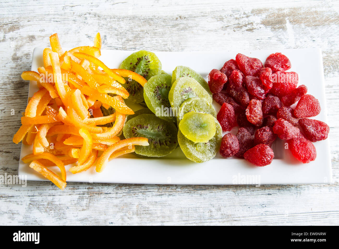 Orange, Kiwi and Strawberry on a plate Stock Photo