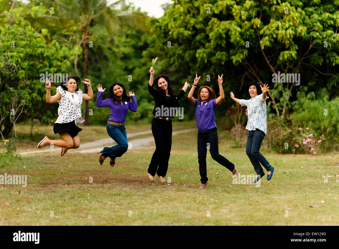 Happy jumping woman field hi-res stock photography and images - Alamy