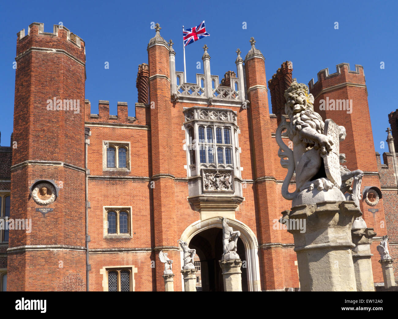 Hampton Court Palace with Union Jack Flag flying, a royal Tudor palace in the London Borough of Richmond upon Thames Greater London Surrey UK Stock Photo