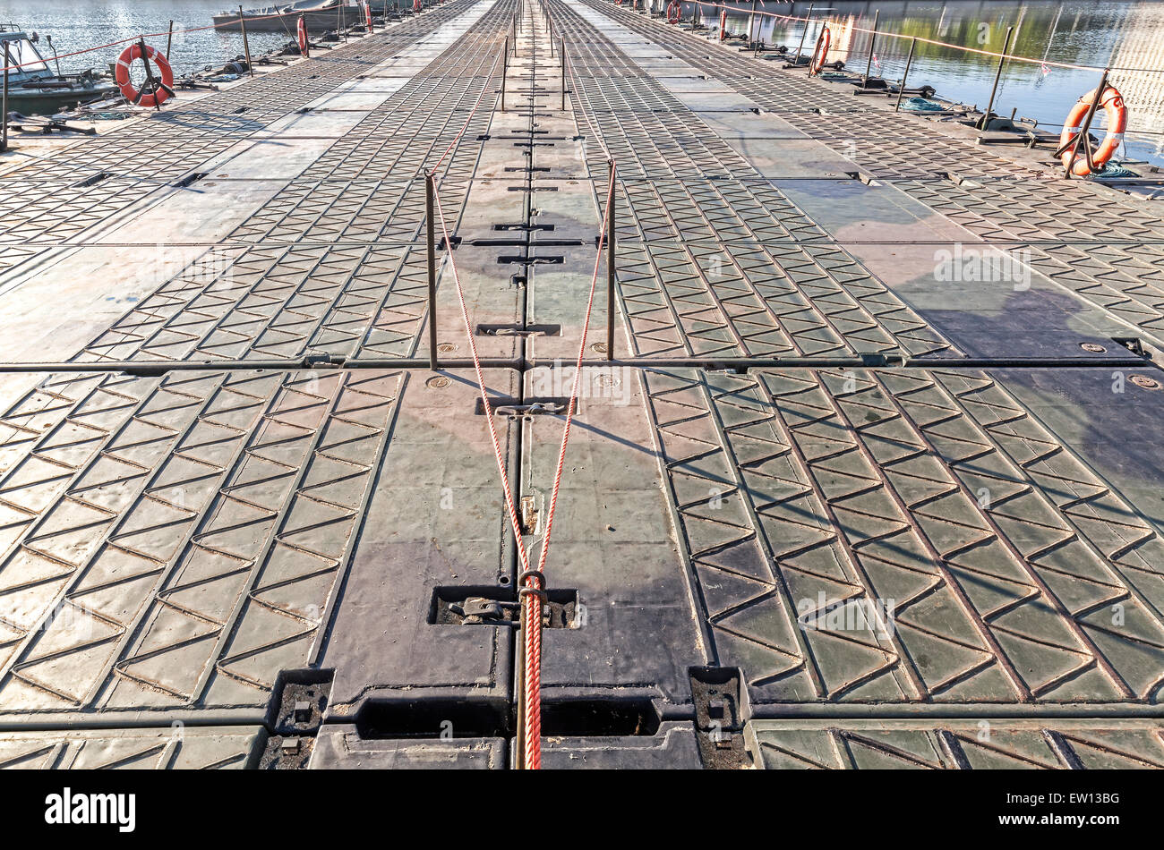 Military floating bridge on a river. Stock Photo